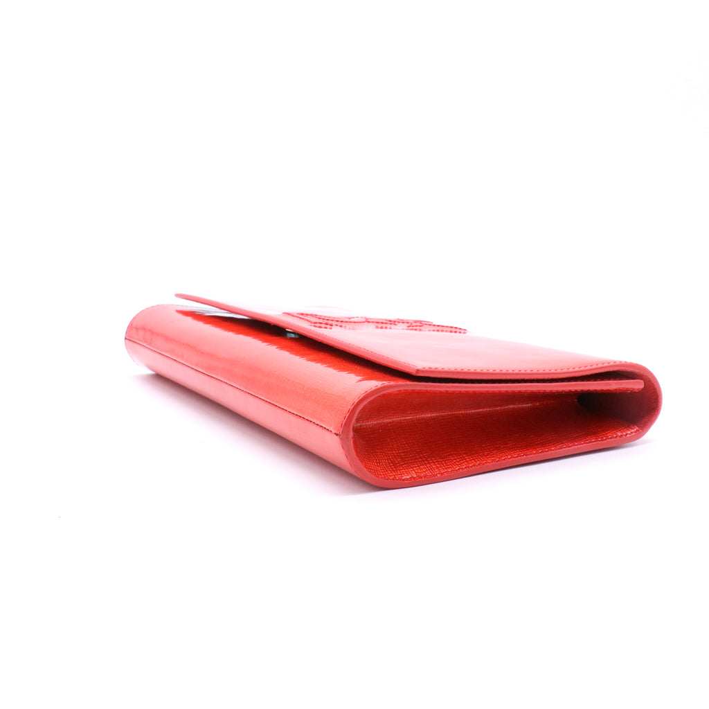 Orange Patent Leather Belle De Jour Clutch twins