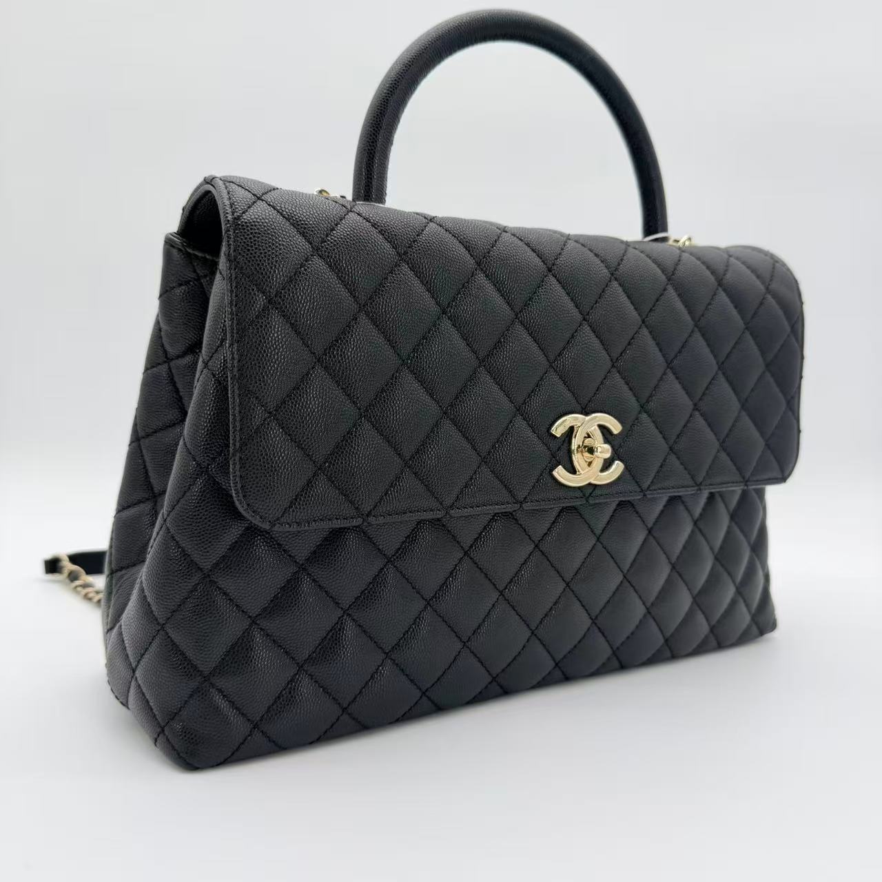 Coco Handle Flap Bag in black caviar leather with gold-tone HW