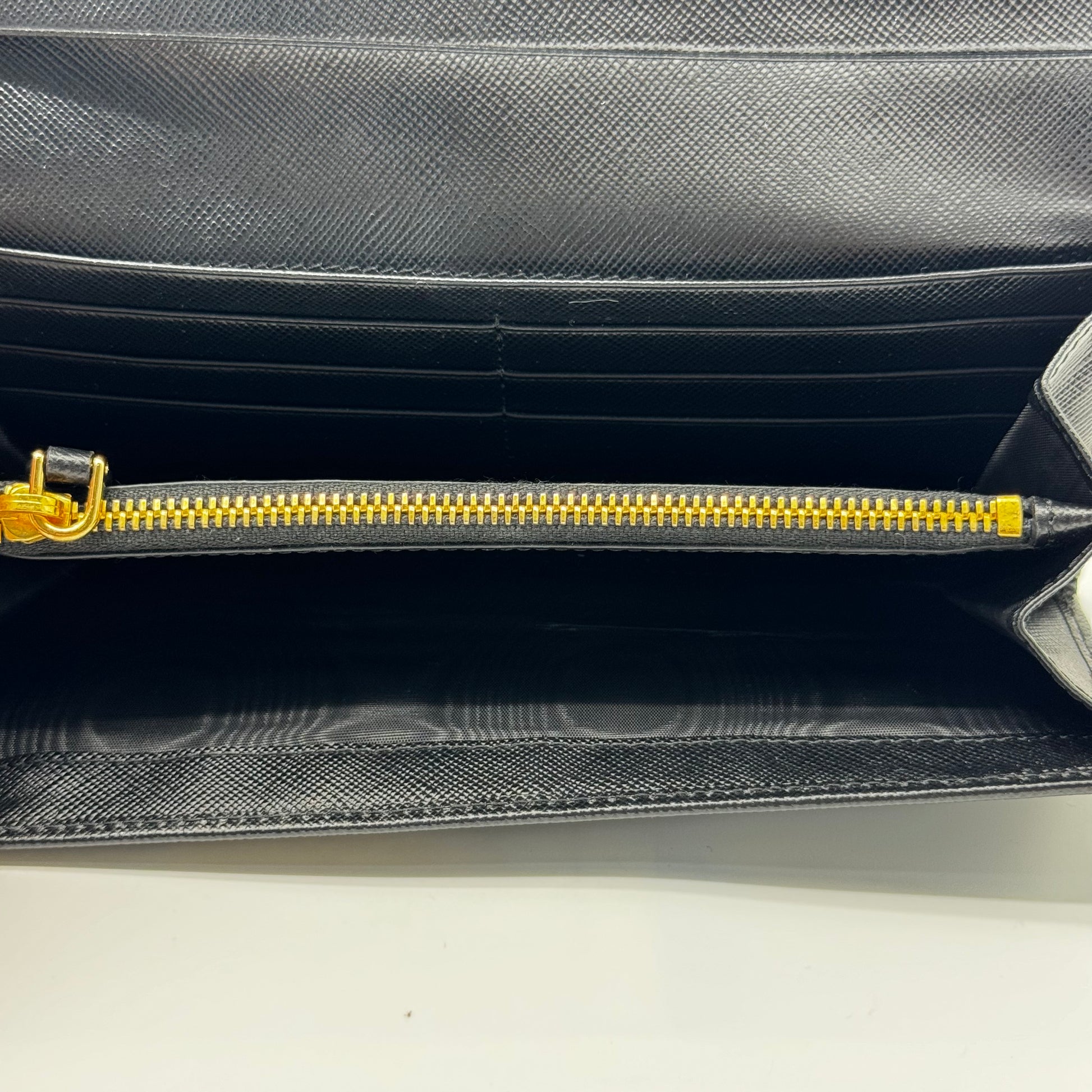 Saffiano Triangle Logo Continental Flap Travel Wallet Black