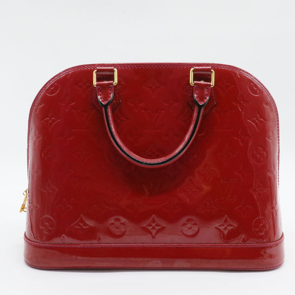 Alma Handbag Monogram Vernis PM