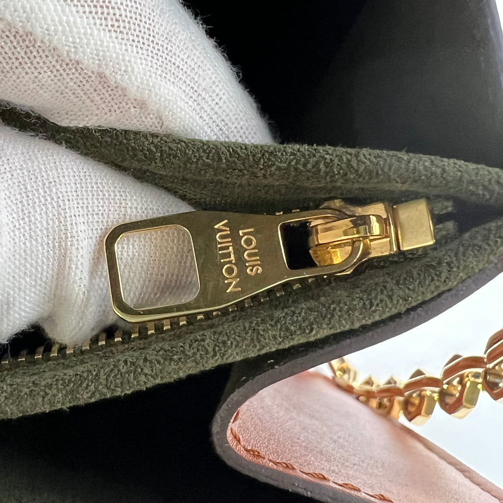 Louis Vuitton LV Garden Dauphine MM bag features a striking metallic blue monogram canvas with a floral print and natural leather trim