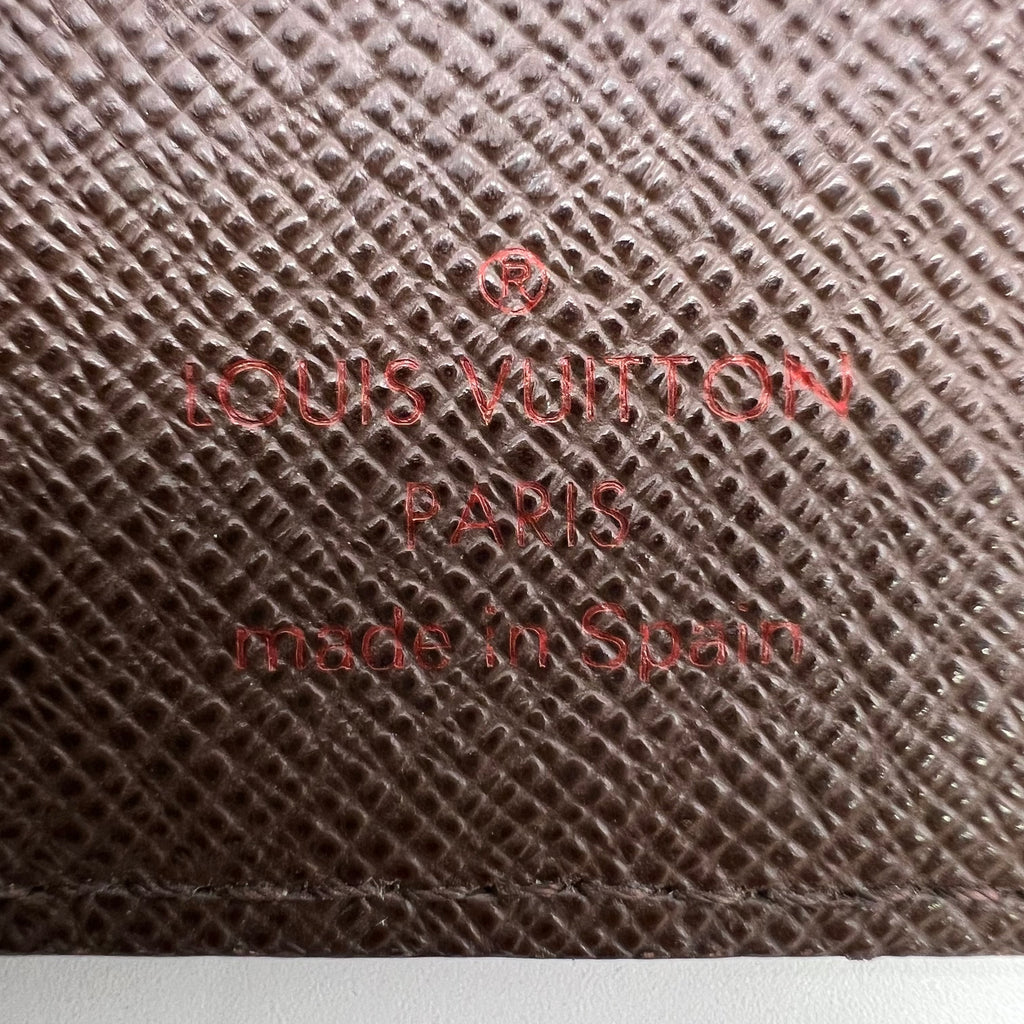 Louis Vuitton Zippy Wallet in Damier Ébène Canvas W22535