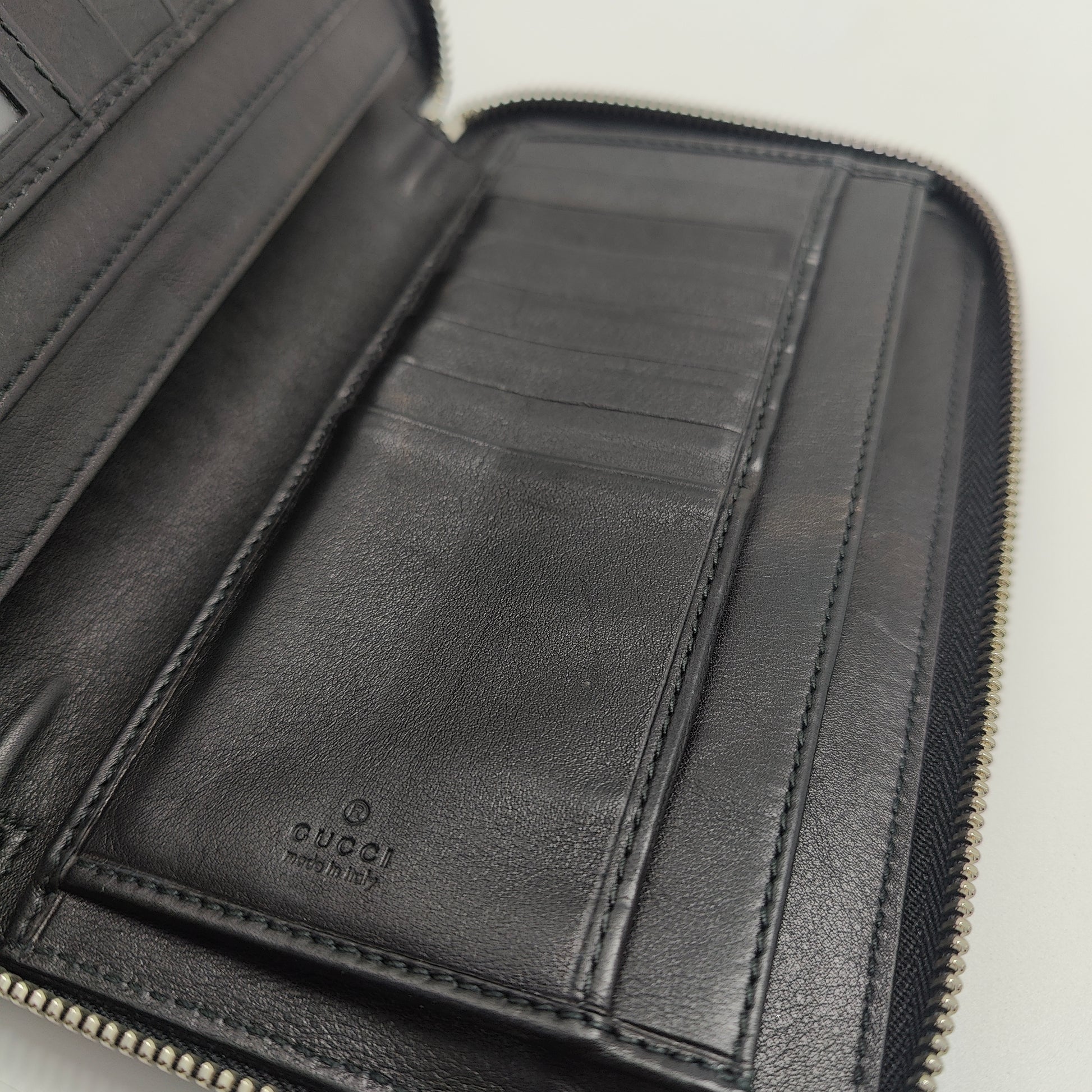 GG Logo Embossed Leather Zipper Long Wallet