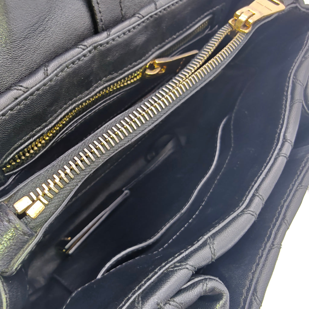 Miu Miu Matelassé 2-way leather bag in black and gold gisel
