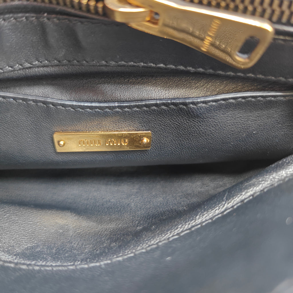 Miu Miu Matelassé 2-way leather bag in black and gold gisel