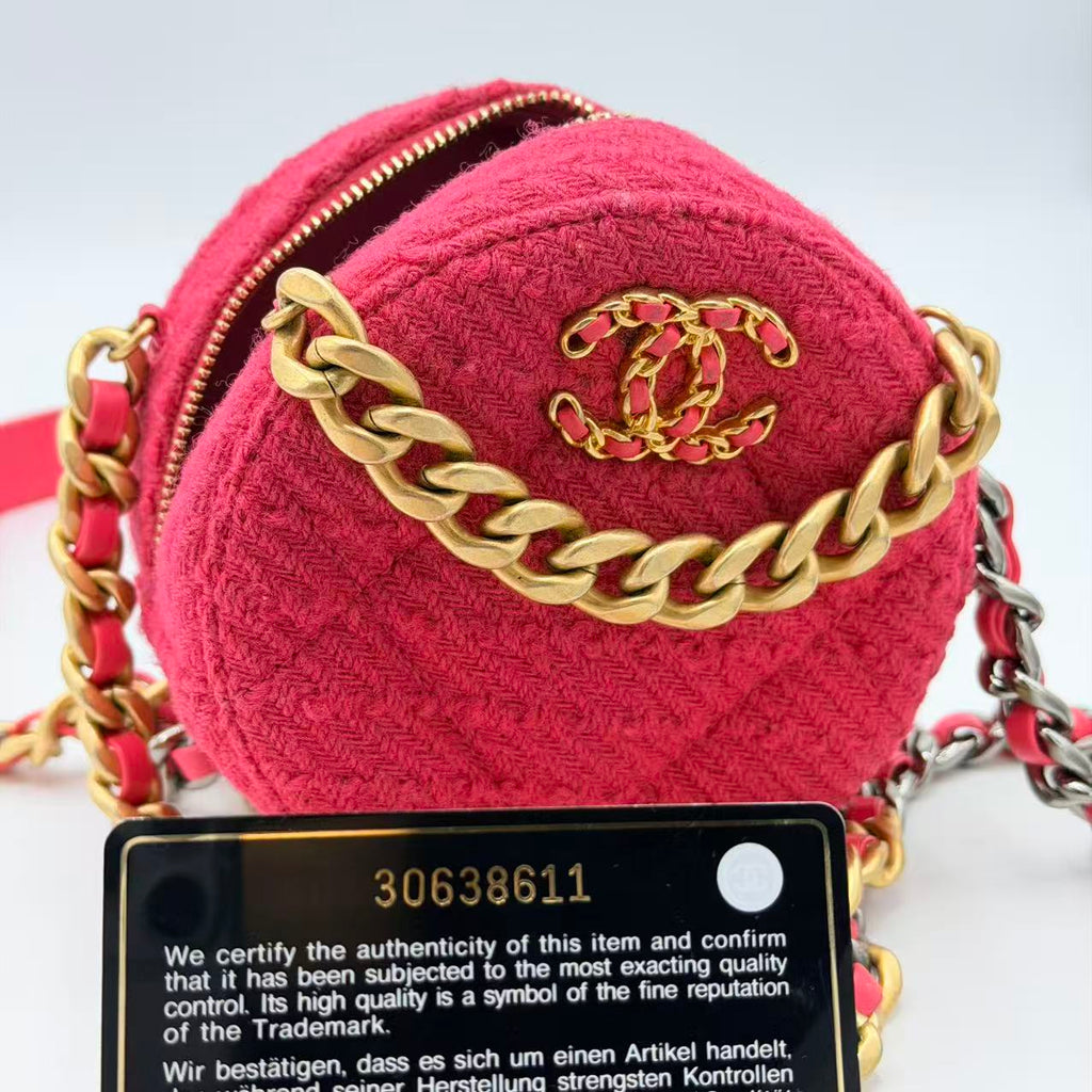 Chanel 19 Round Clutch in pink tweed