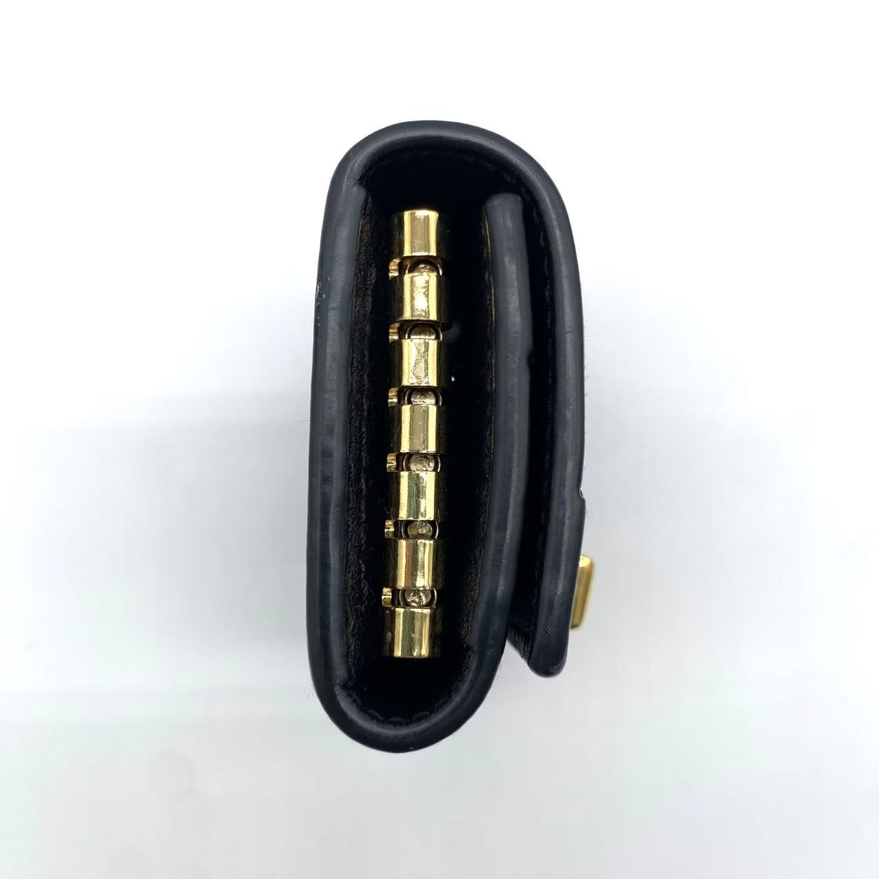 Calfskin GG Monogram Embossed 6 Key Holder Black