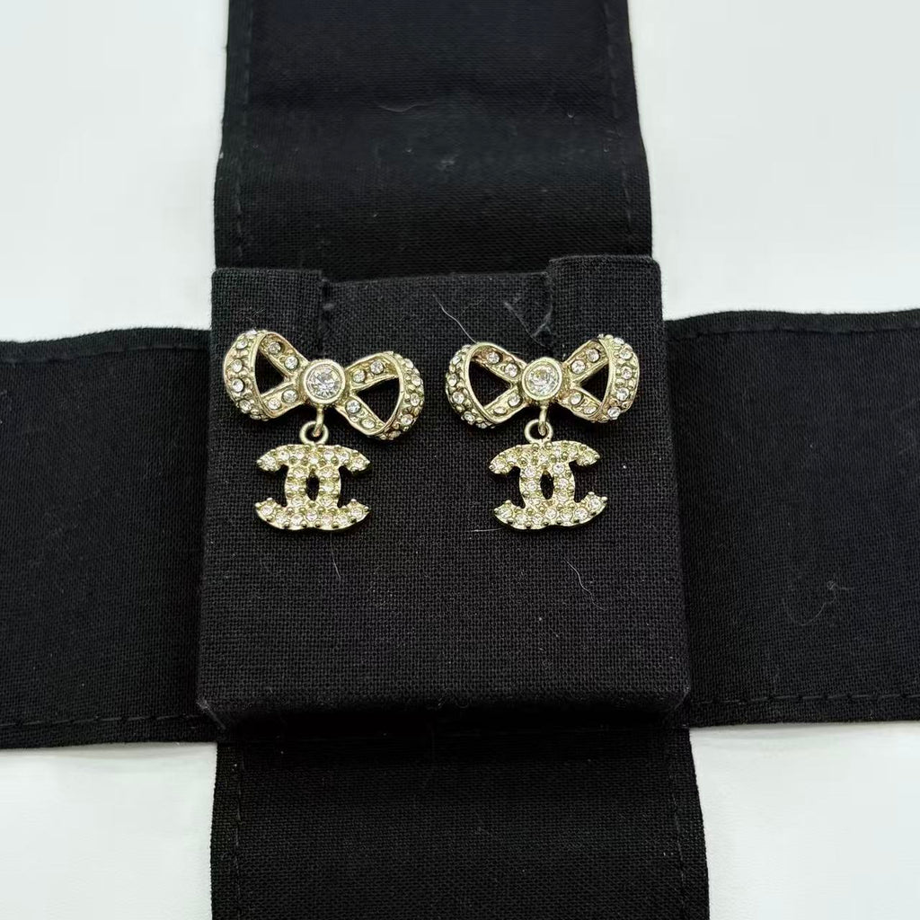 Crystal CC Bow Dangle Earrings Gold