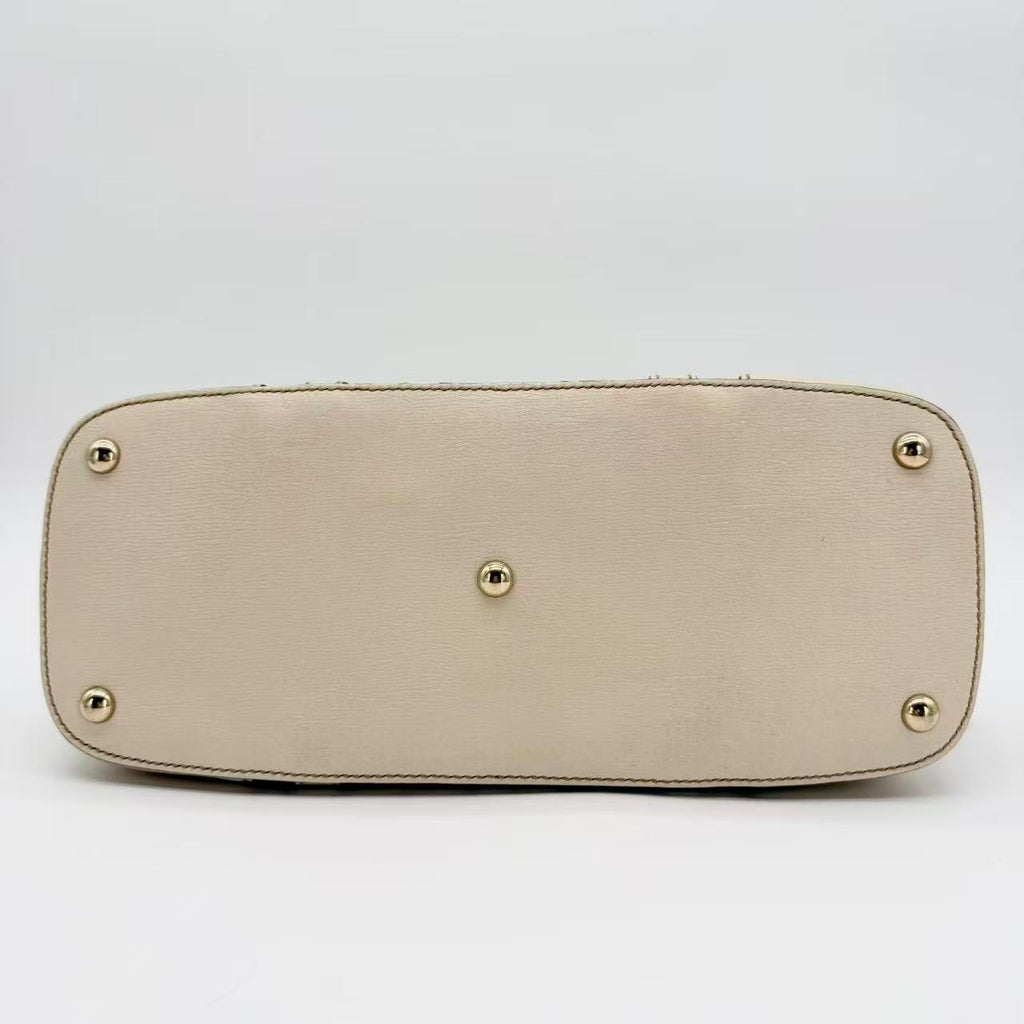 Flora Nice Dome Satchel in white with a multicolour floral print
