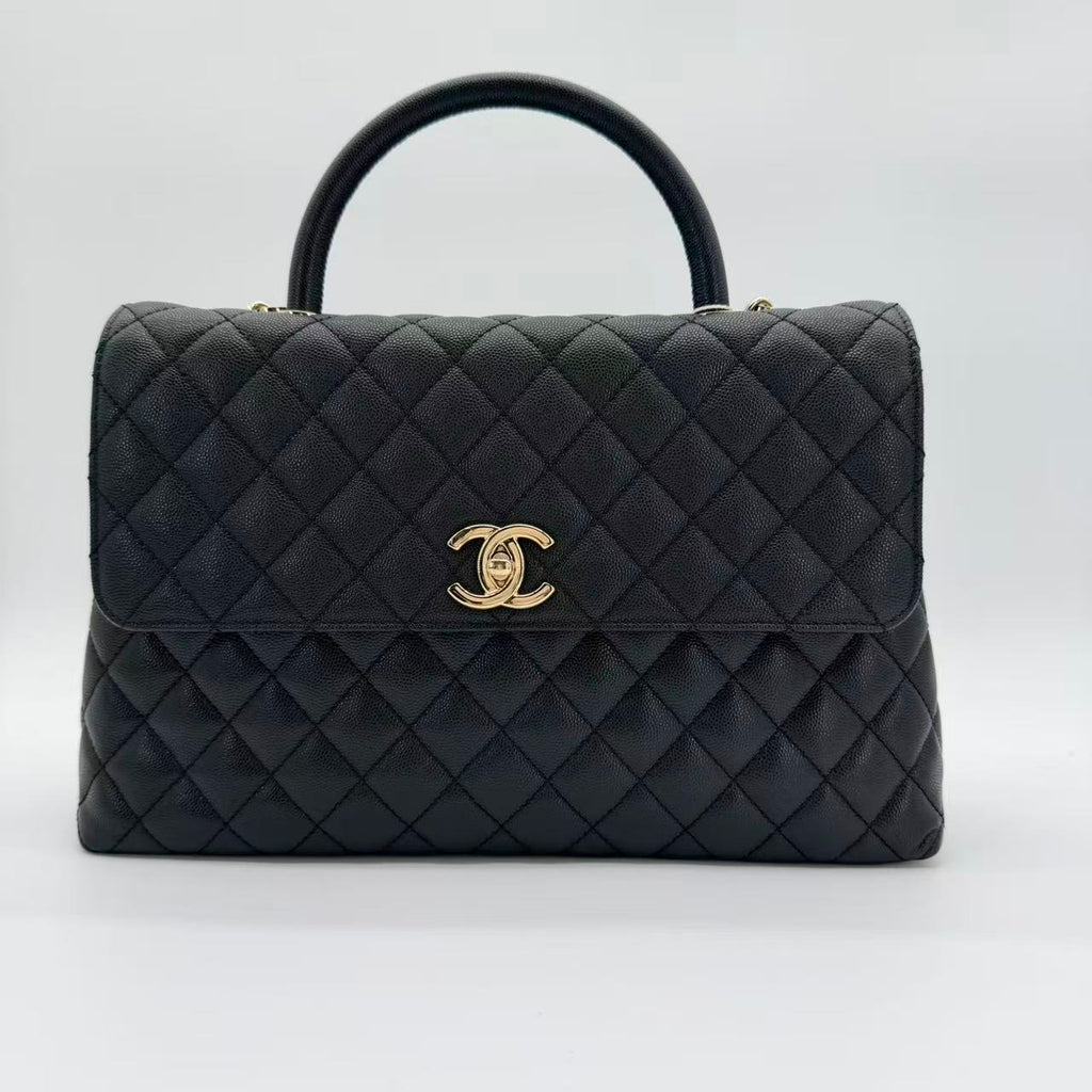 Coco Handle Flap Bag in black caviar leather with gold-tone HW