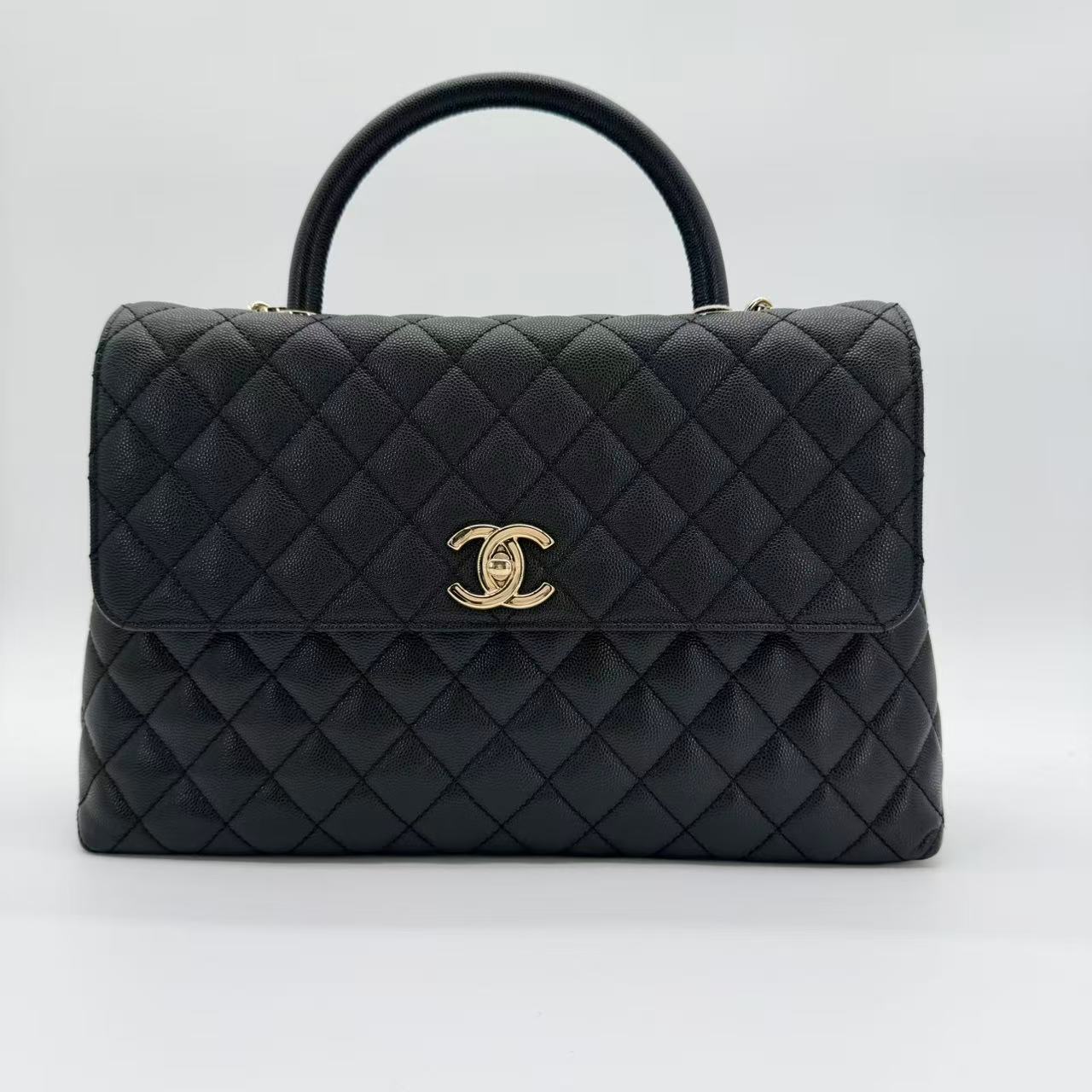 Coco Handle Flap Bag in black caviar leather with gold-tone HW