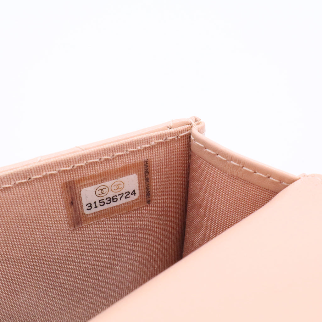 CHANEL mini shoulder bag in nude khaki leather with quilted pattern featuring a chain strap and gold hardware twins