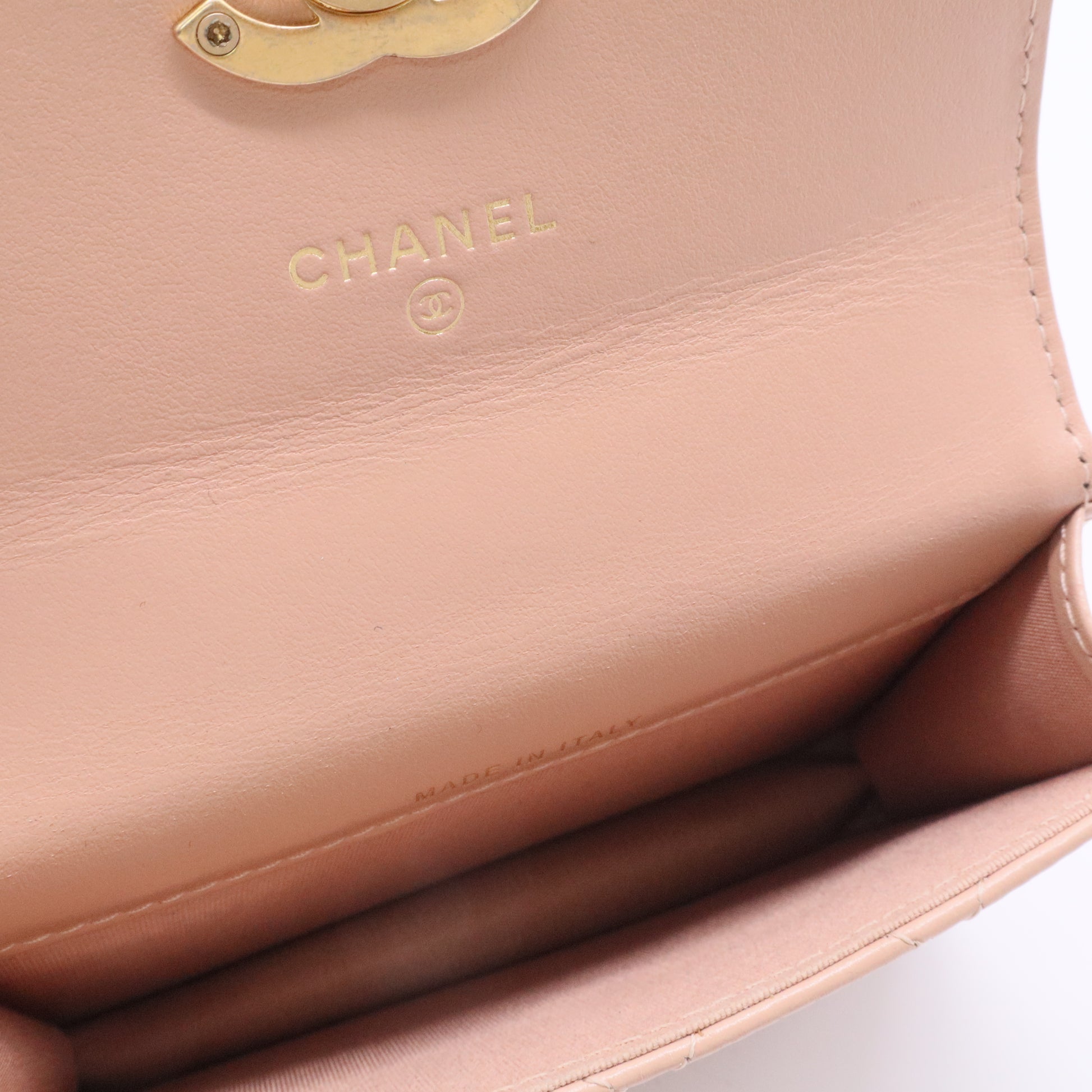 CHANEL mini shoulder bag in nude khaki leather with quilted pattern featuring a chain strap and gold hardware twins