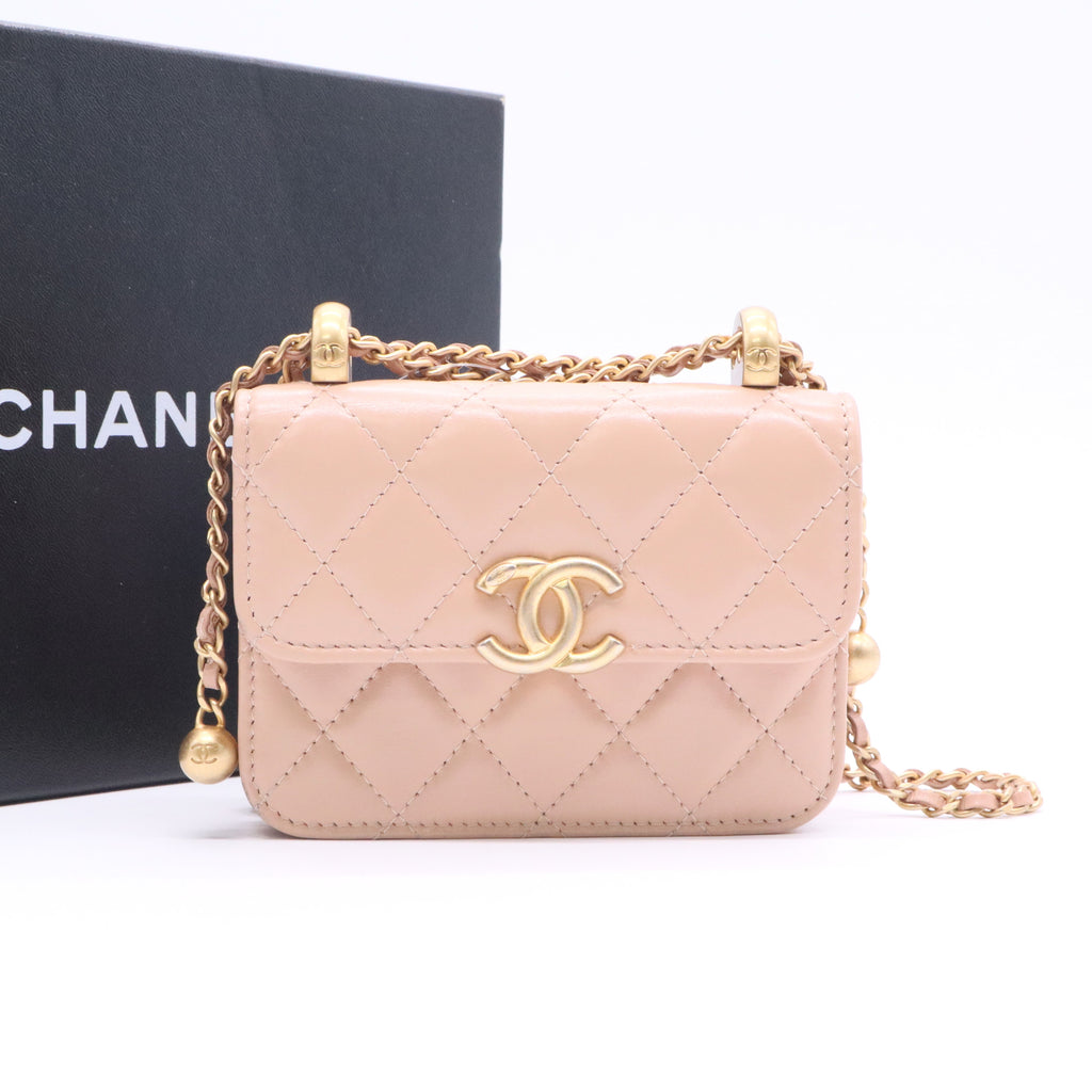 CHANEL mini shoulder bag in nude khaki leather with quilted pattern featuring a chain strap and gold hardware twins