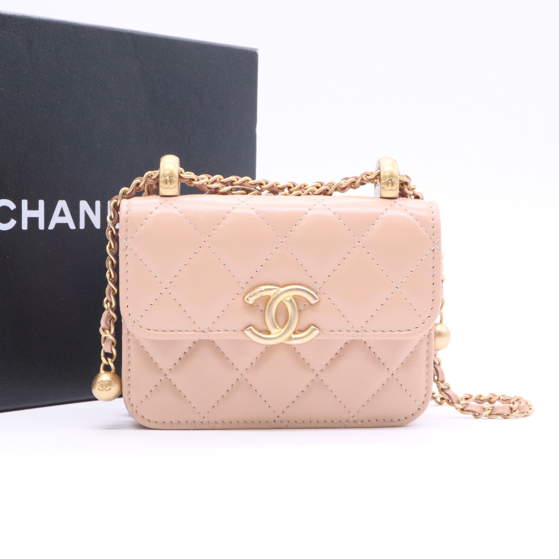 CHANEL mini shoulder bag in nude khaki leather with quilted pattern featuring a chain strap and gold hardware twins