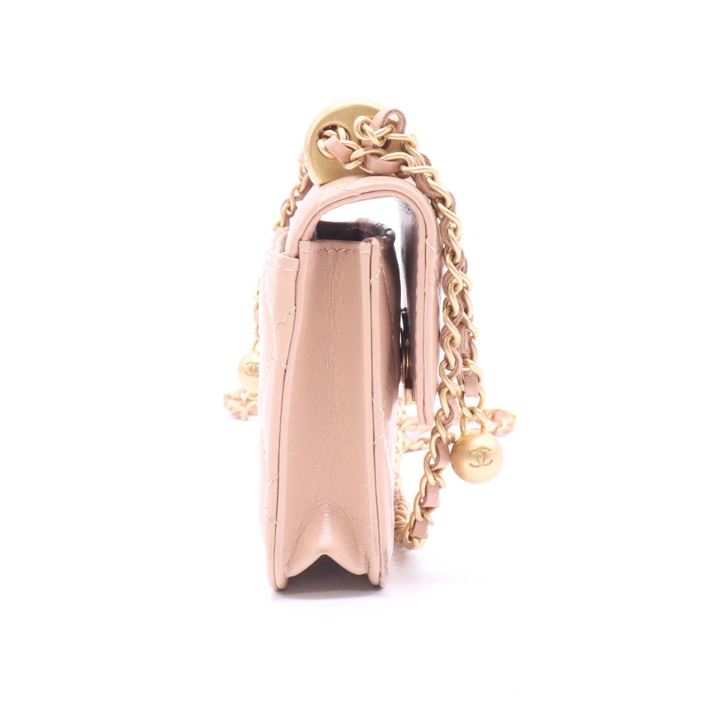 CHANEL mini shoulder bag in nude khaki leather with quilted pattern featuring a chain strap and gold hardware twins