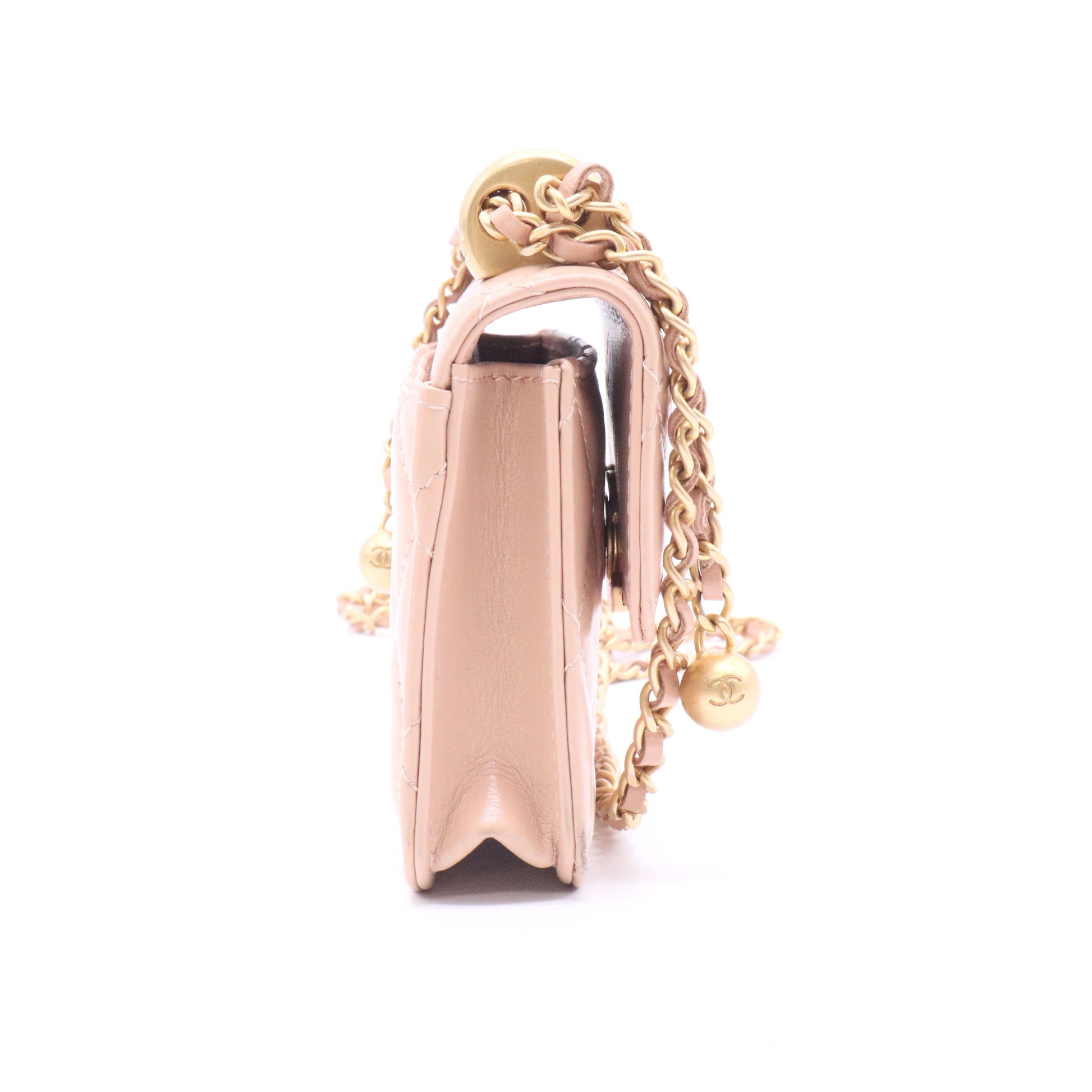 CHANEL mini shoulder bag in nude khaki leather with quilted pattern featuring a chain strap and gold hardware twins