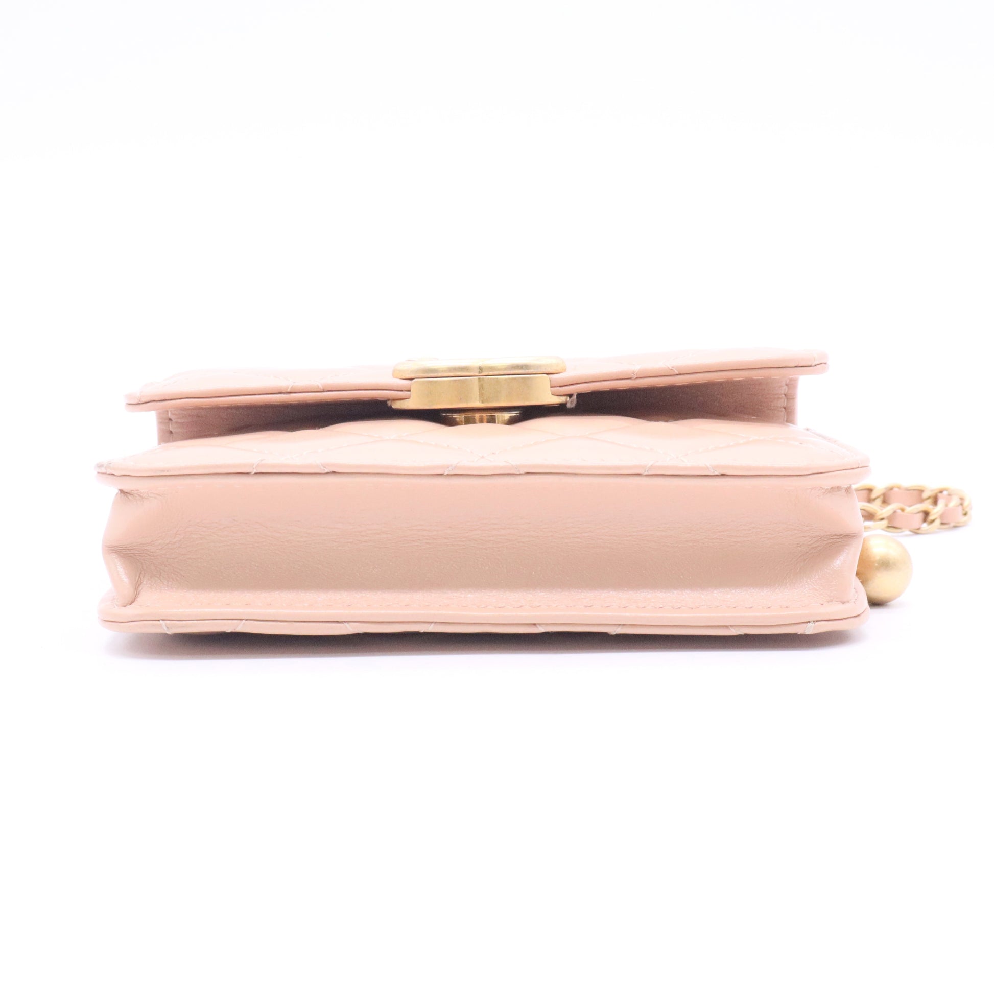 CHANEL mini shoulder bag in nude khaki leather with quilted pattern featuring a chain strap and gold hardware twins