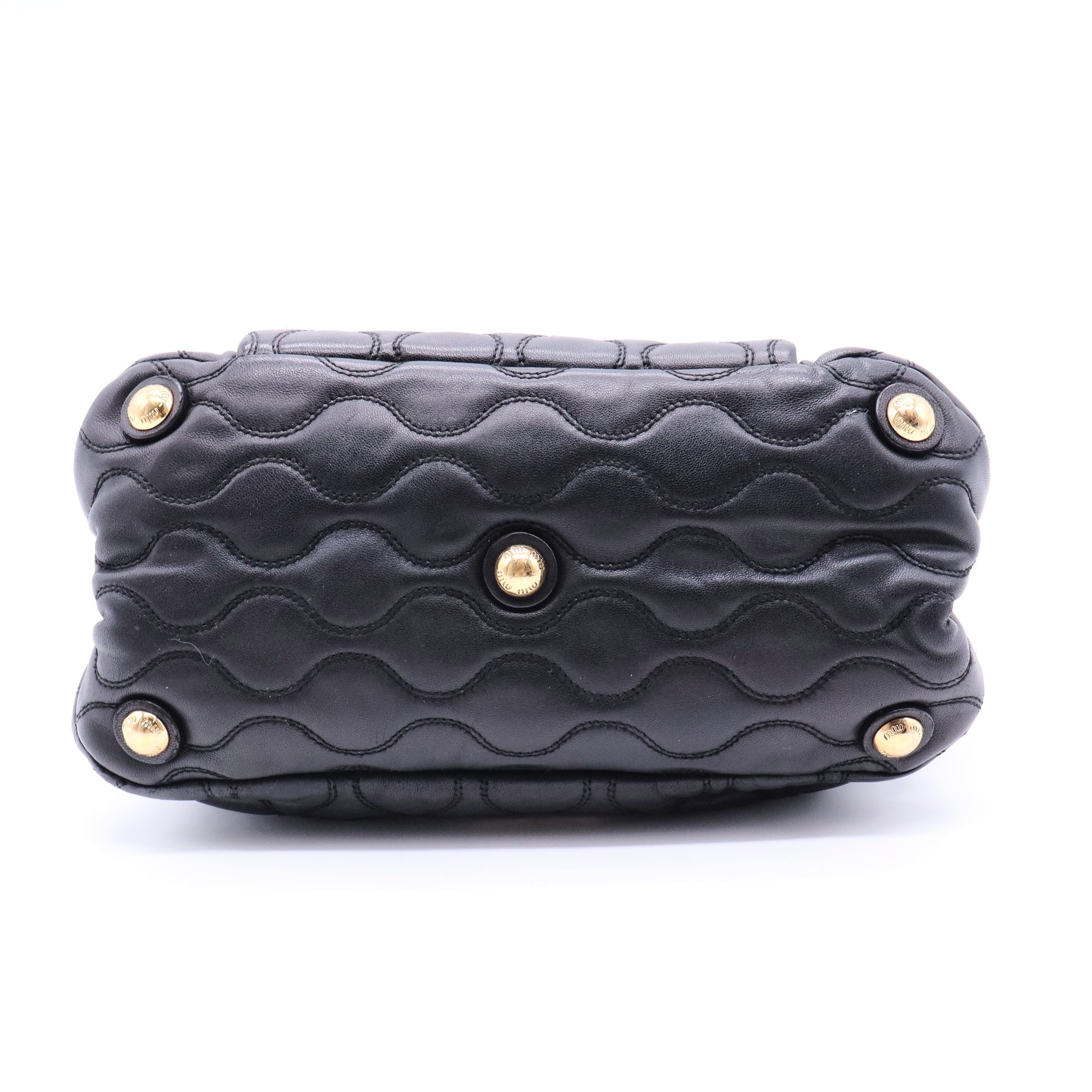 Miu Miu Matelassé 2-way leather bag in black and gold gisel