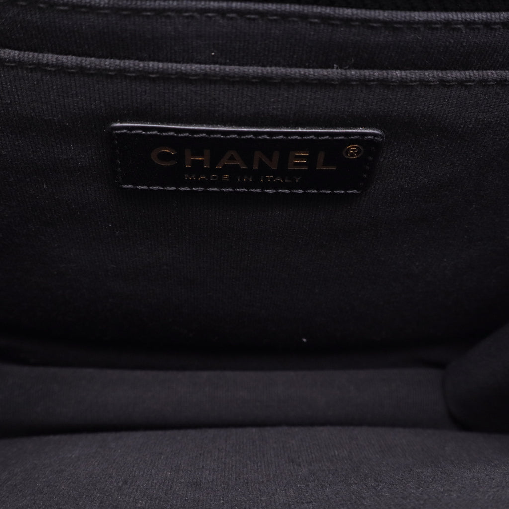 Chanel Flap Backpack in black leather with gold-tone hardware twins