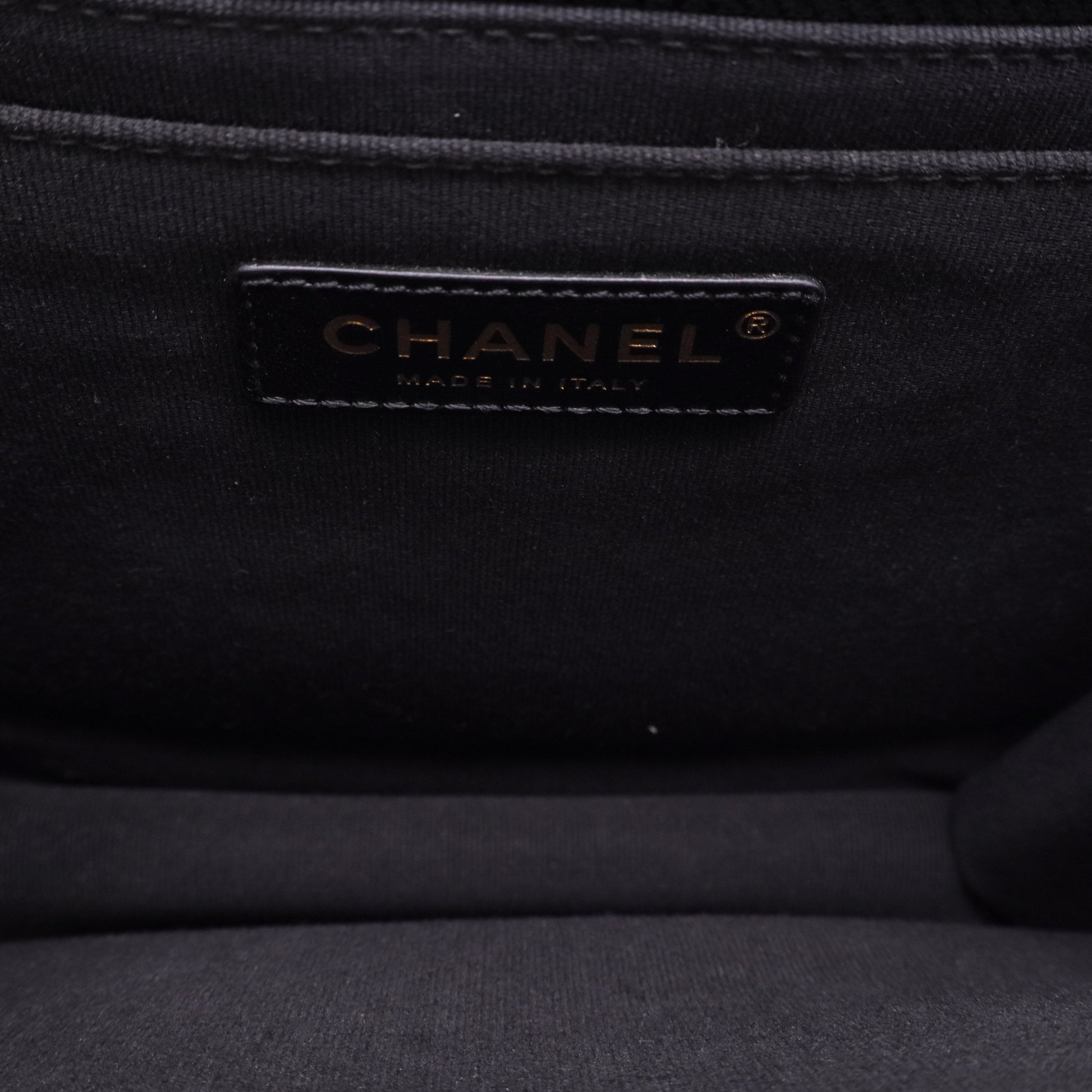 Chanel Flap Backpack in black leather with gold-tone hardware twins