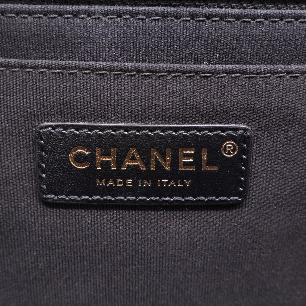 Chanel Flap Backpack in black leather with gold-tone hardware twins