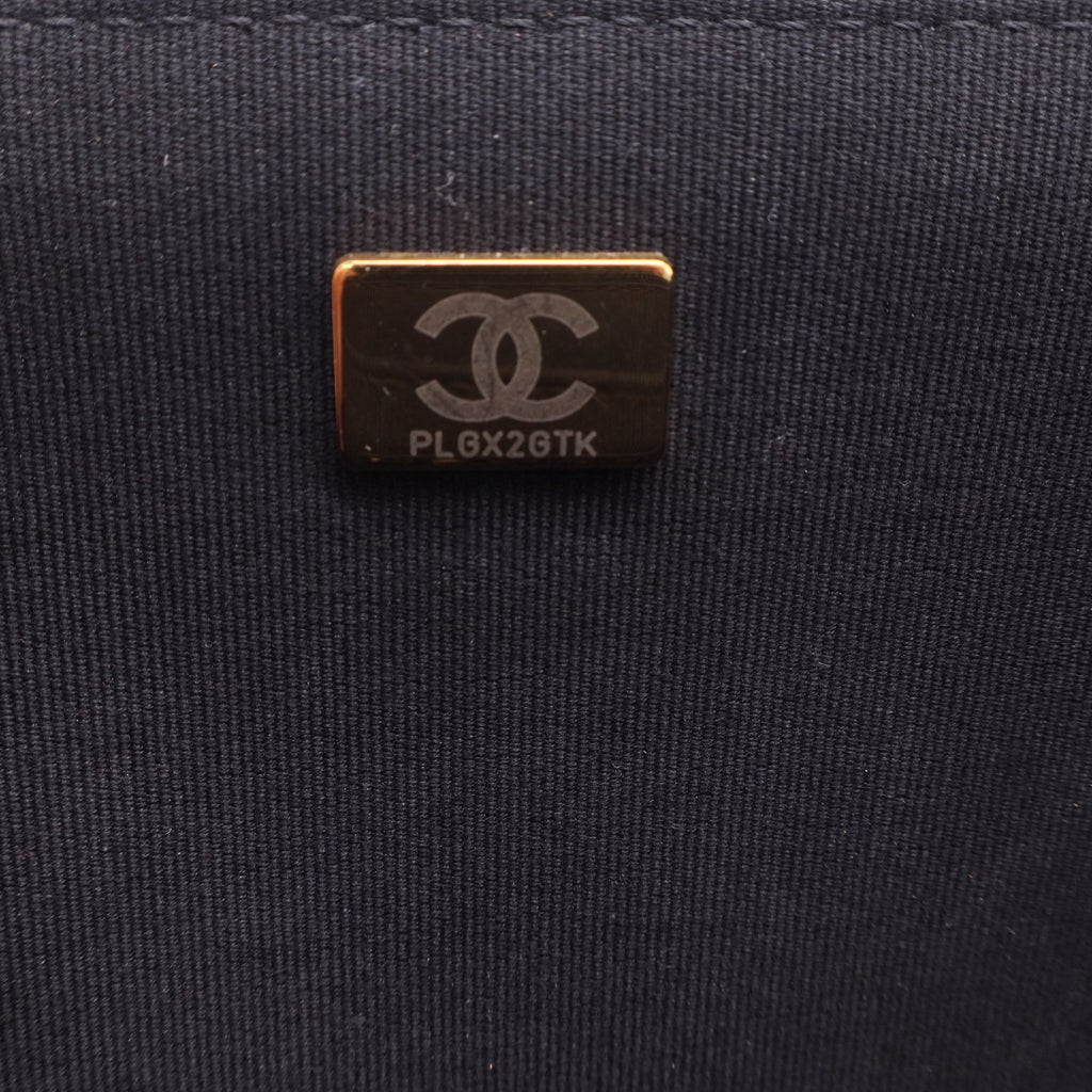Chanel Flap Backpack in black leather with gold-tone hardware twins