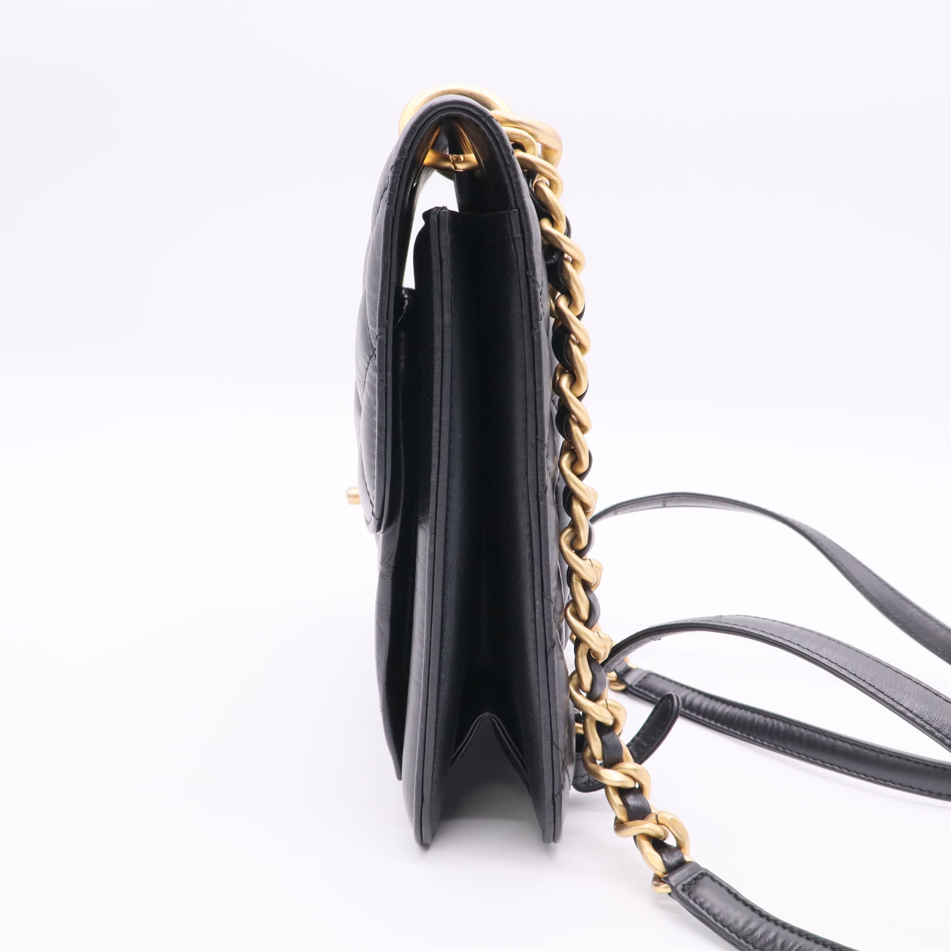 Chanel Flap Backpack in black leather with gold-tone hardware twins