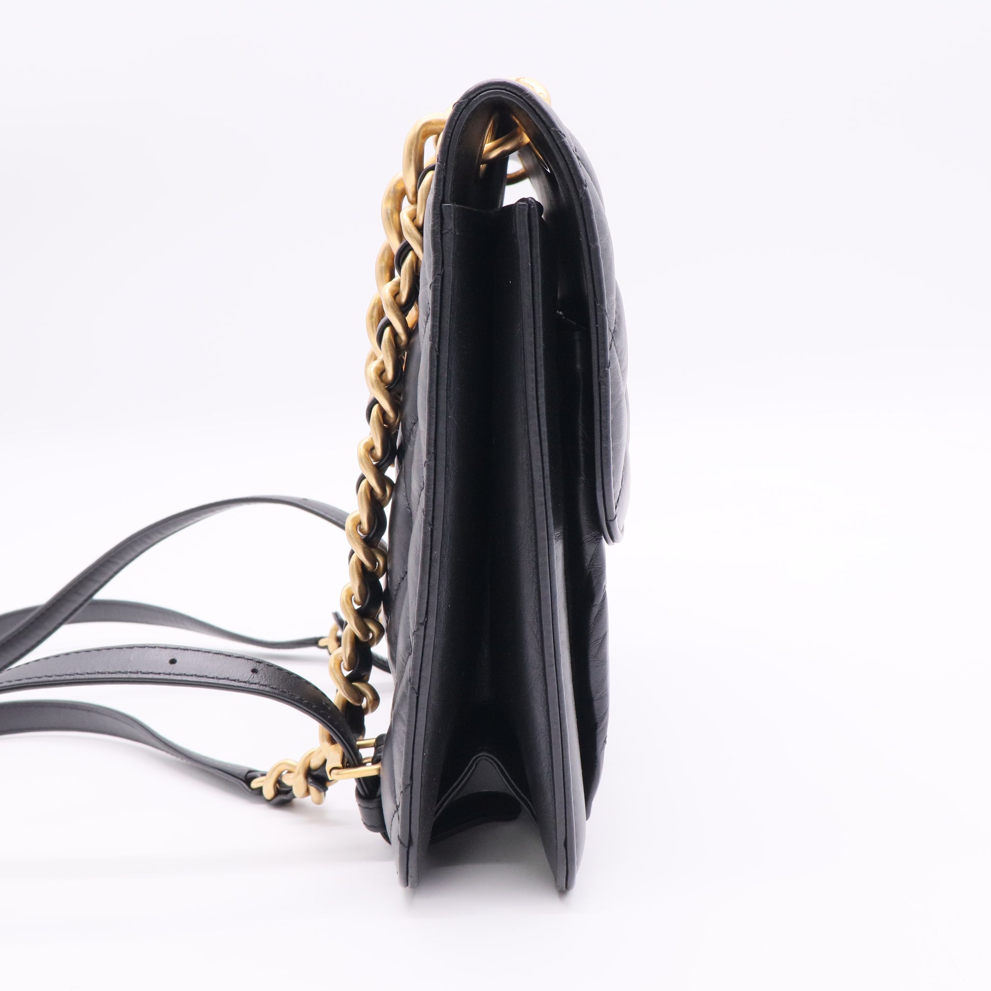 Chanel Flap Backpack in black leather with gold-tone hardware twins