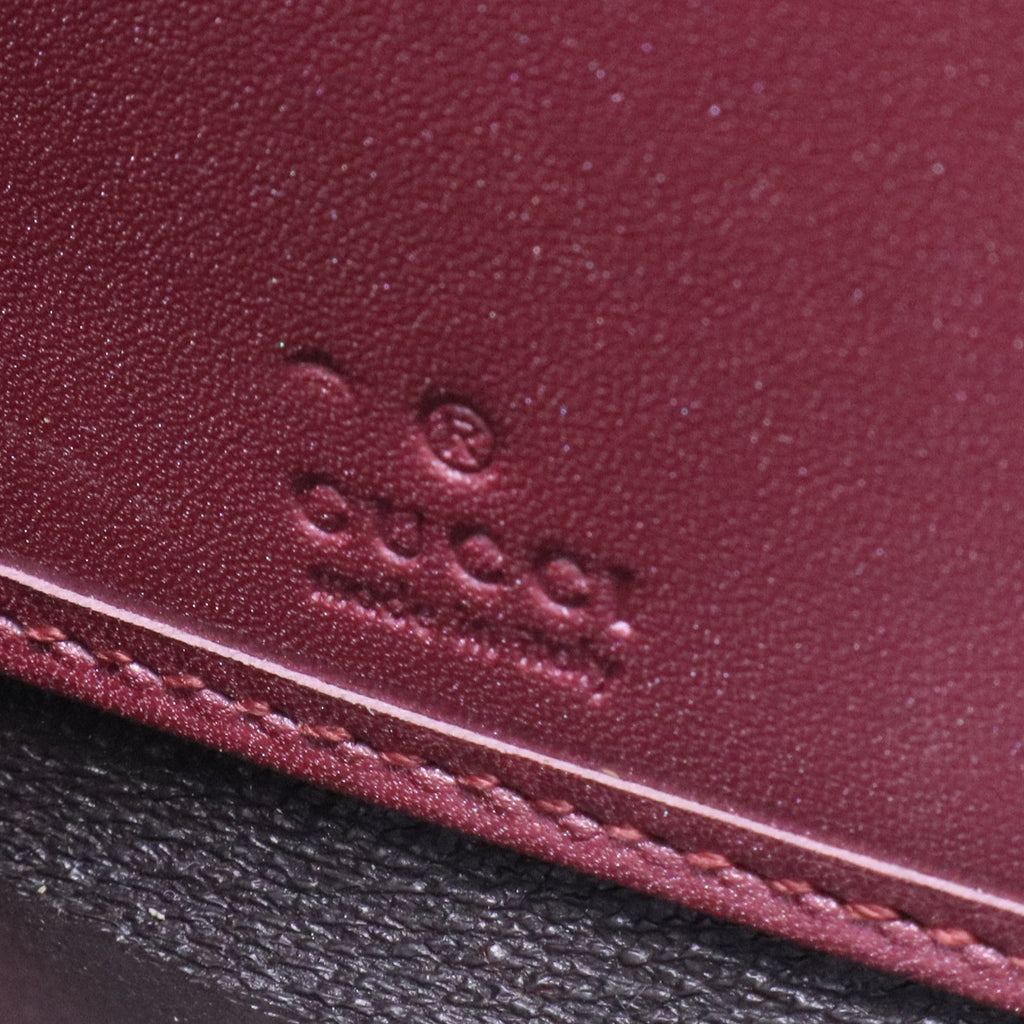Pink Guccissima metallic wallet