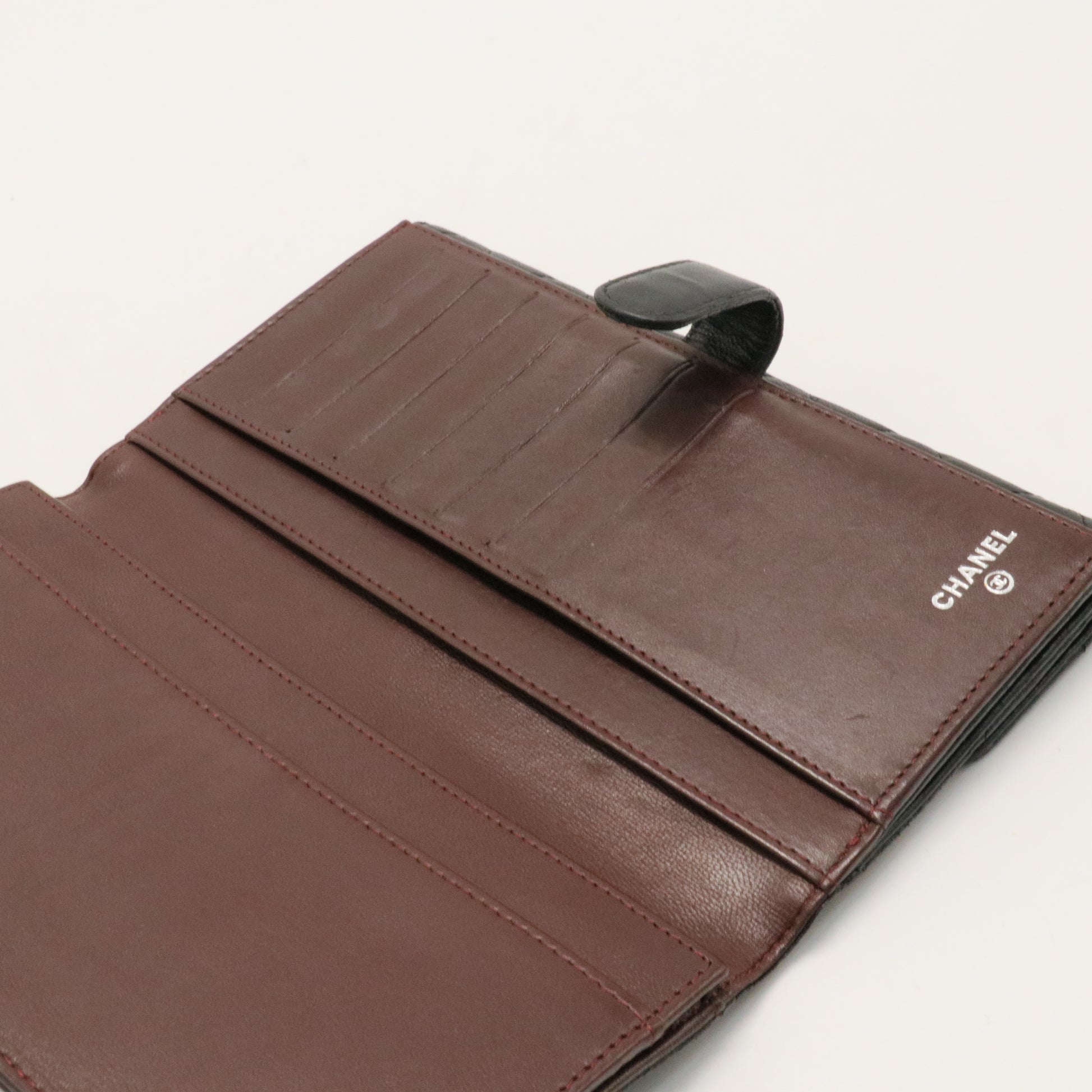 Bi-fold long wallet black gold matelasse