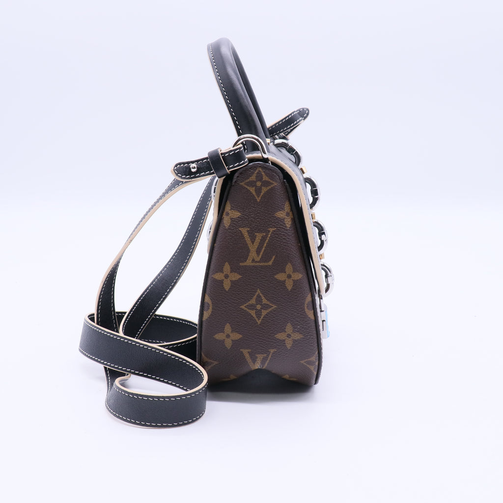 Chain It Handbag Monogram Canvas with Leather PM B20601