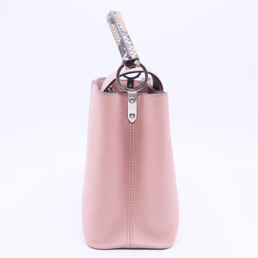 Capucines BB handbag in pink Taurillon leather with a python handle