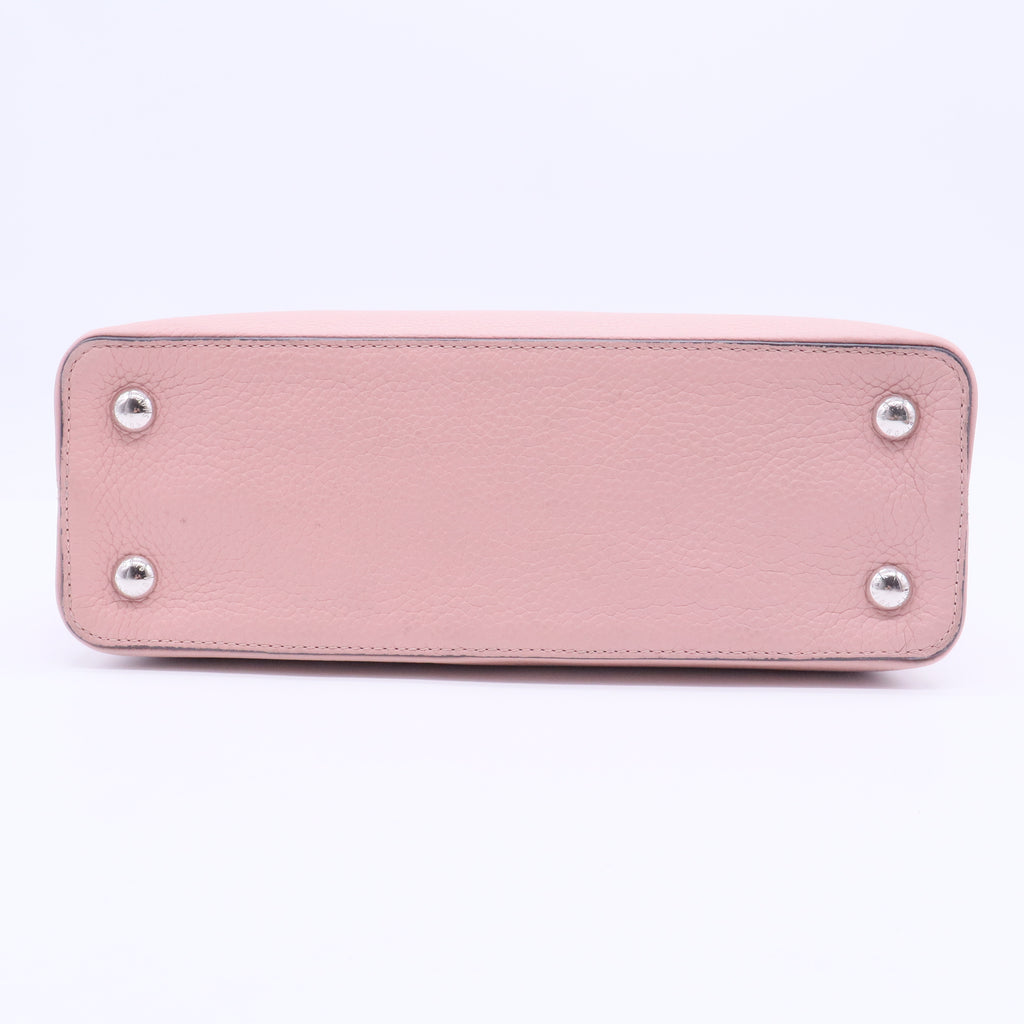 Capucines BB handbag in pink Taurillon leather with a python handle