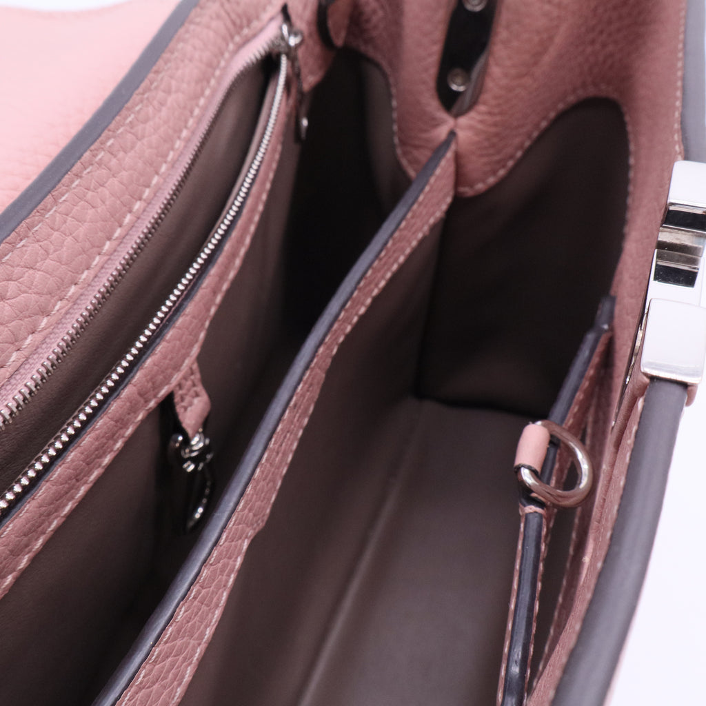Capucines BB handbag in pink Taurillon leather with a python handle