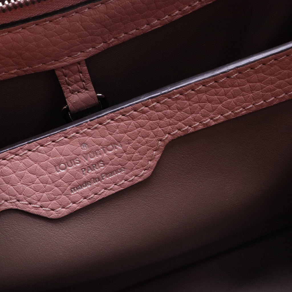 Capucines BB handbag in pink Taurillon leather with a python handle