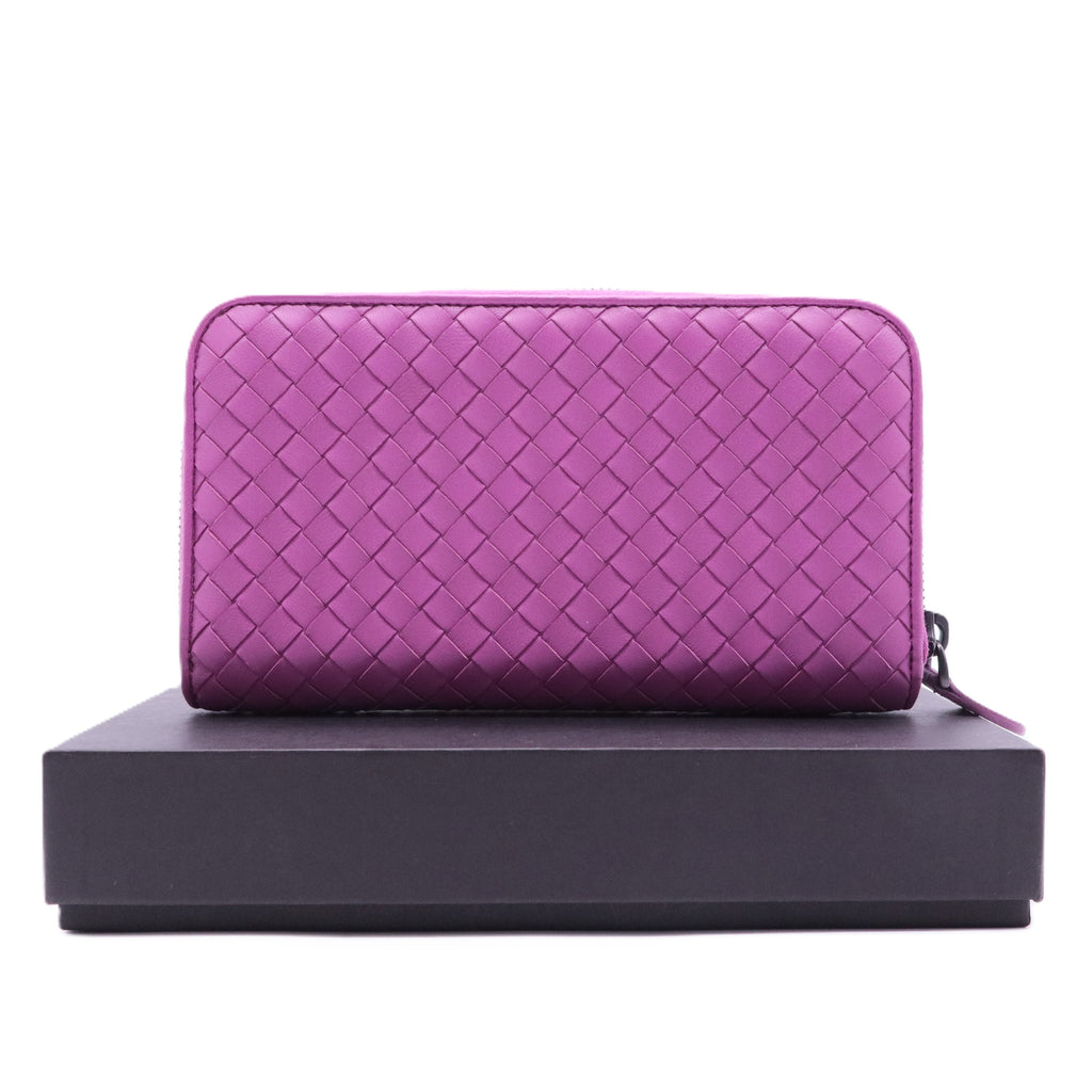 Bottega Veneta Intrecciato leather zip-around wallet in a purple or orchid color