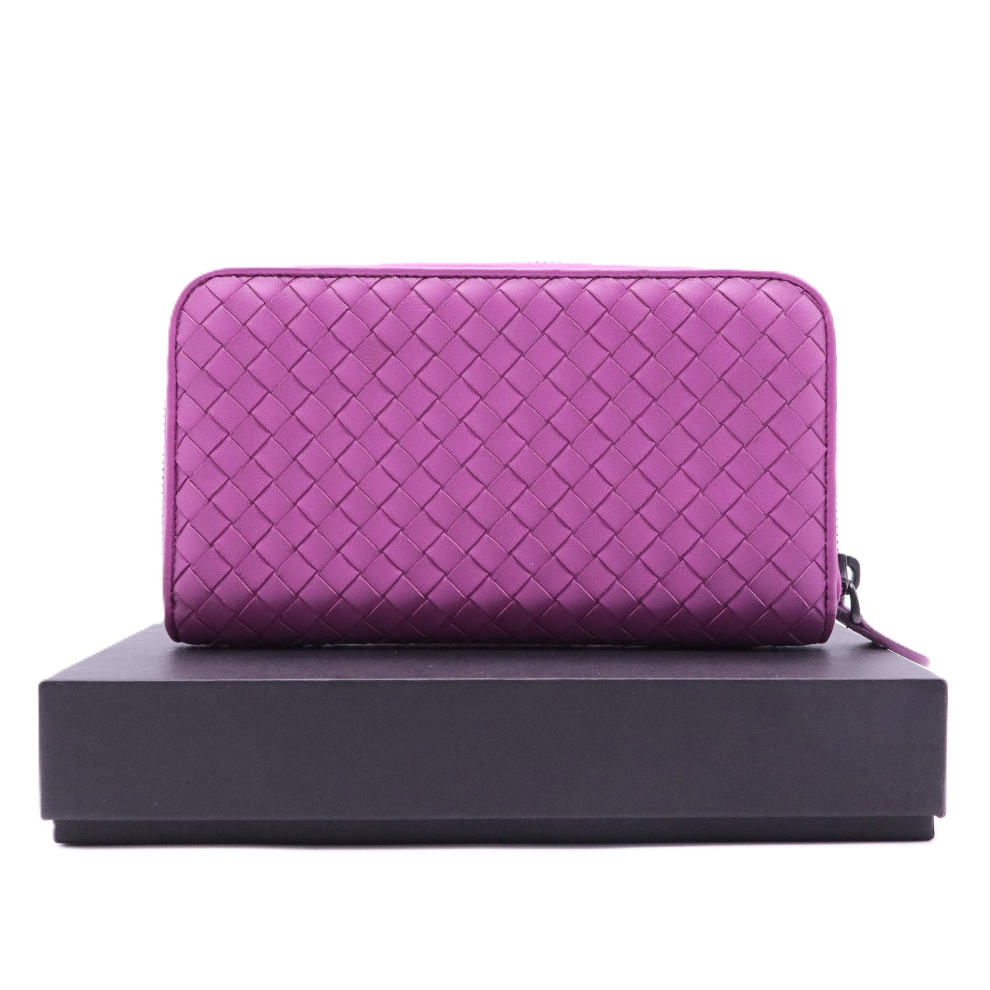 Bottega Veneta Intrecciato leather zip-around wallet in a purple or orchid color
