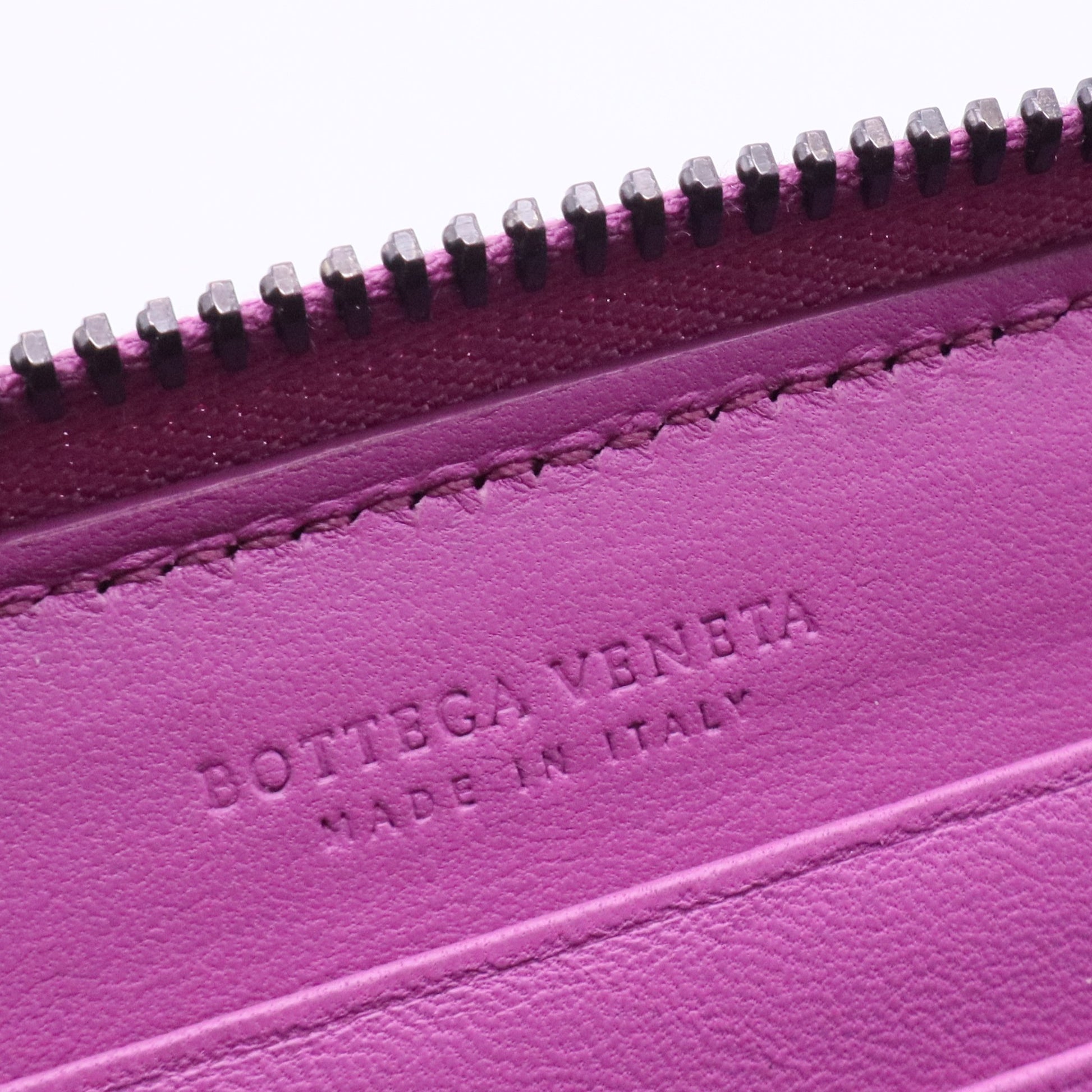 Bottega Veneta Intrecciato leather zip-around wallet in a purple or orchid color