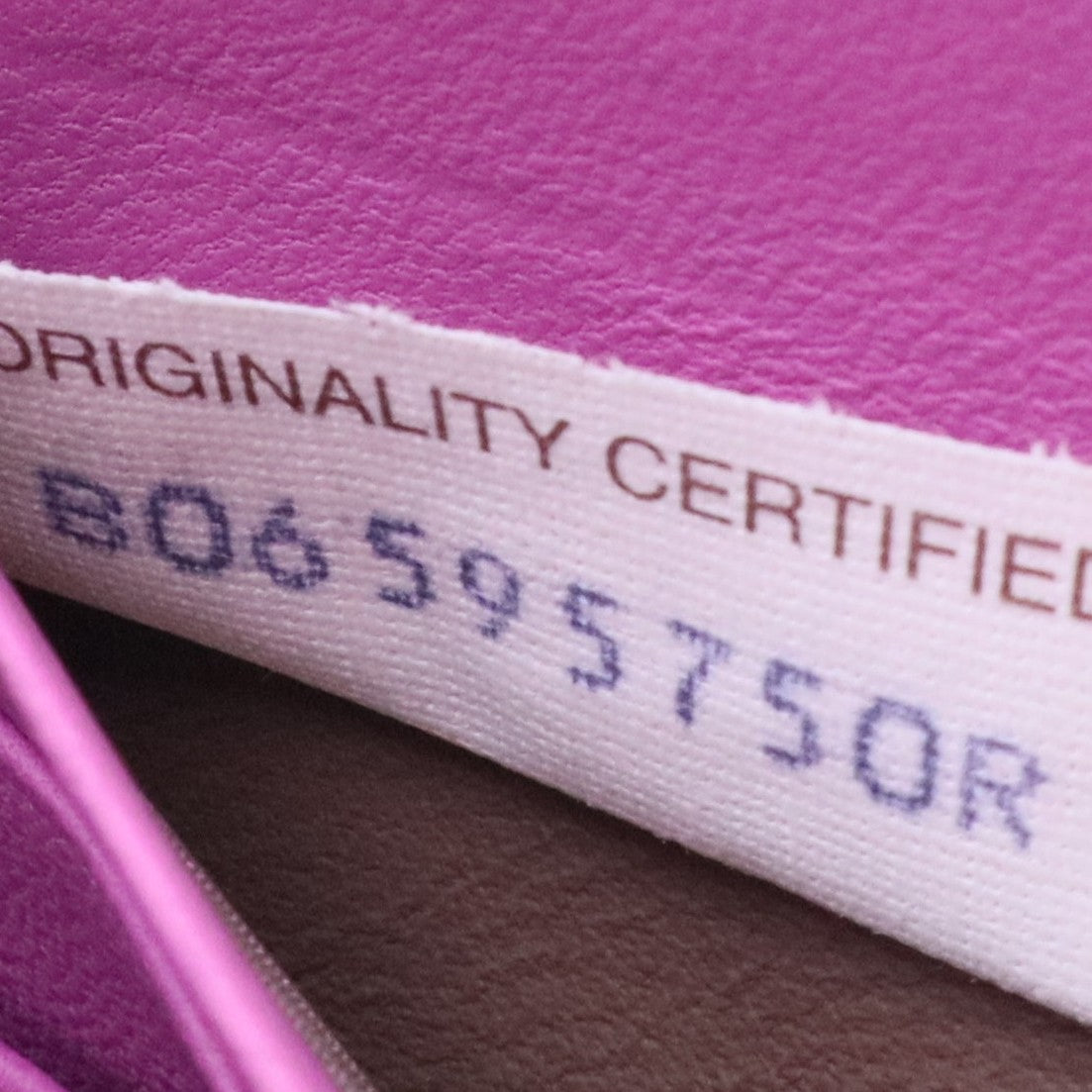 Bottega Veneta Intrecciato leather zip-around wallet in a purple or orchid color