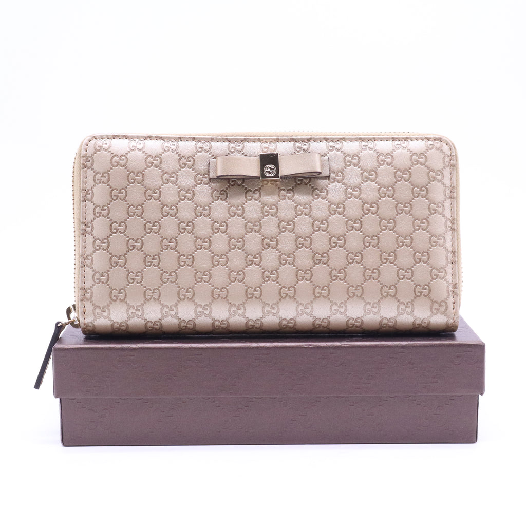 Gucci Microguccissima Bow Zip Around Wallet W21029