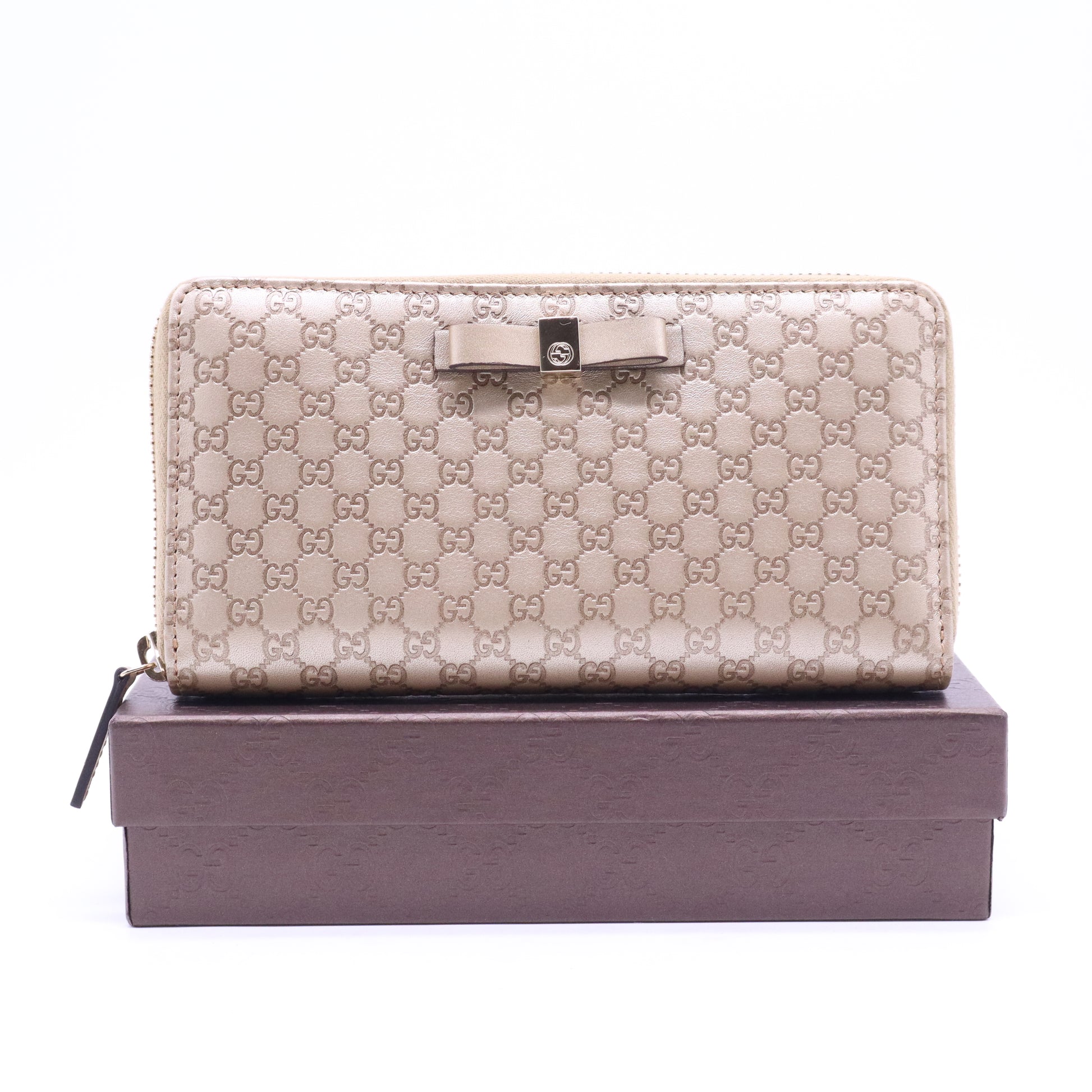 Gucci Microguccissima Bow Zip Around Wallet W21029