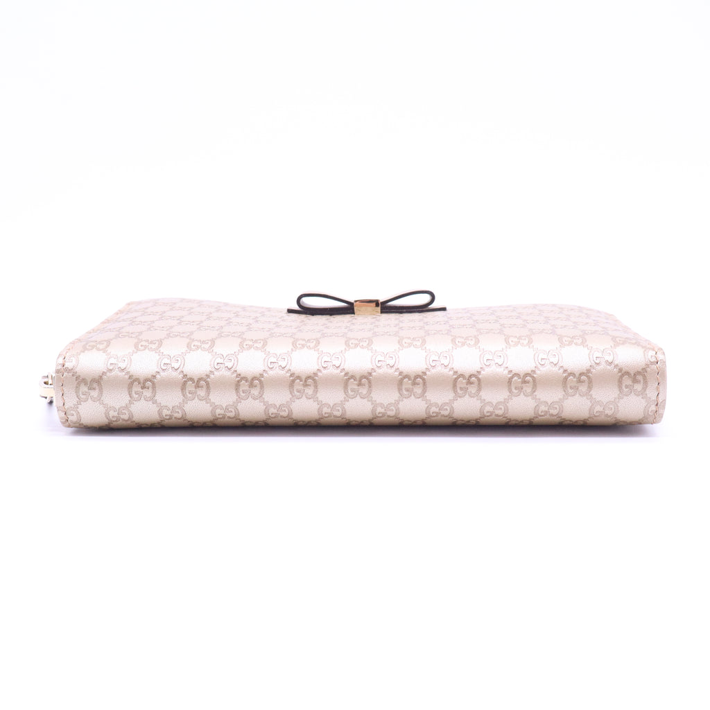 Gucci Microguccissima Bow Zip Around Wallet W21029