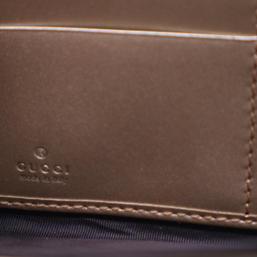 Gucci Microguccissima Bow Zip Around Wallet W21029