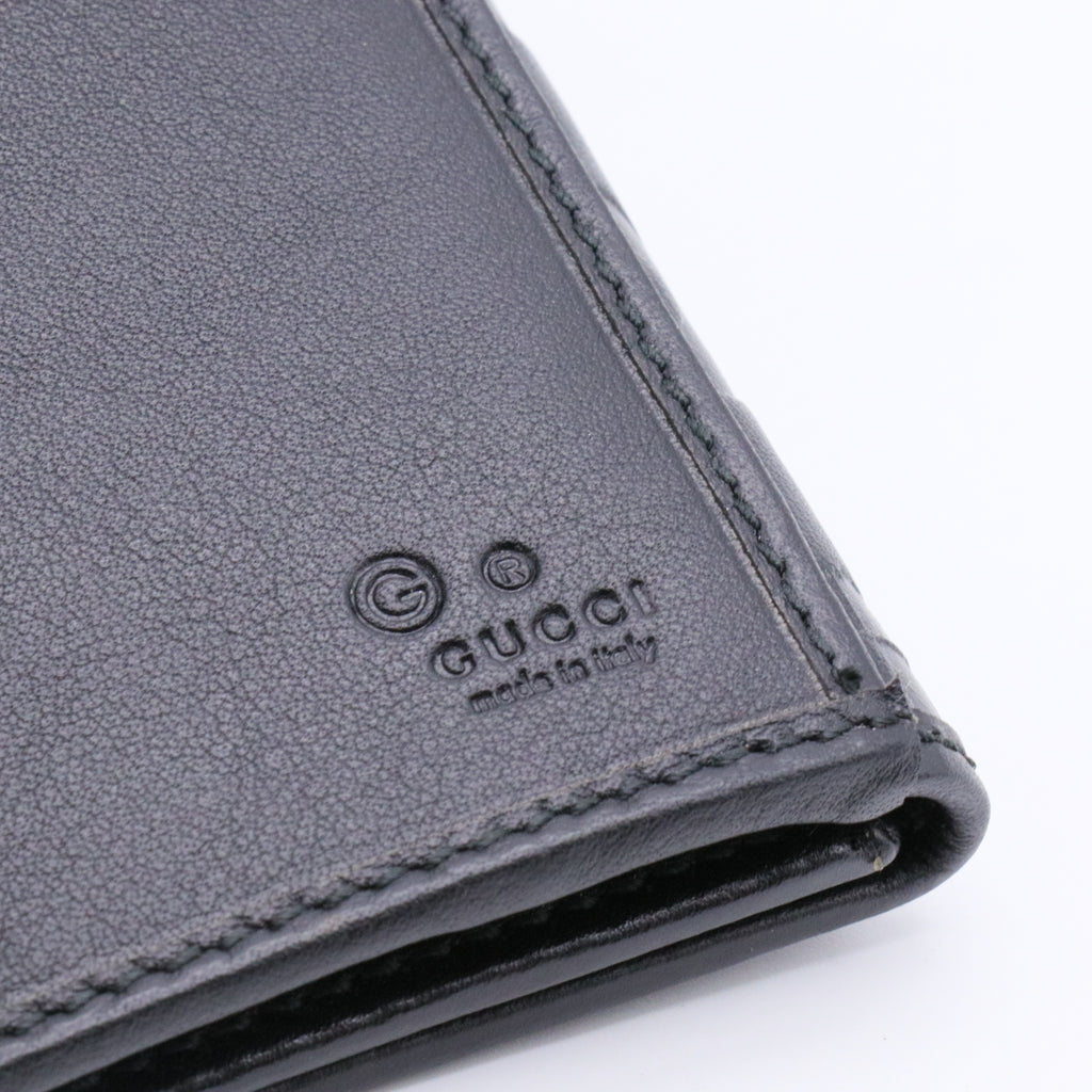 Black Guccissima Leather Continental Flap Wallet twins