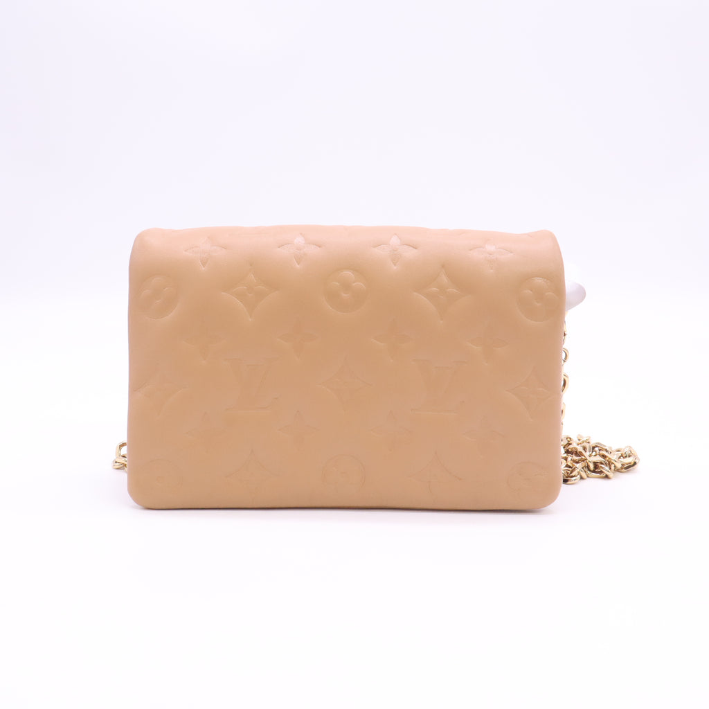 Lambskin Embossed Monogram Pochette Coussin Camel B24552