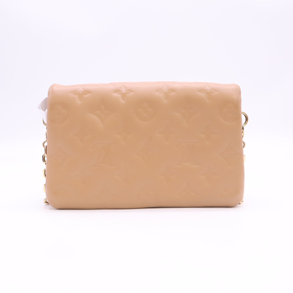 Lambskin Embossed Monogram Pochette Coussin Camel B24552