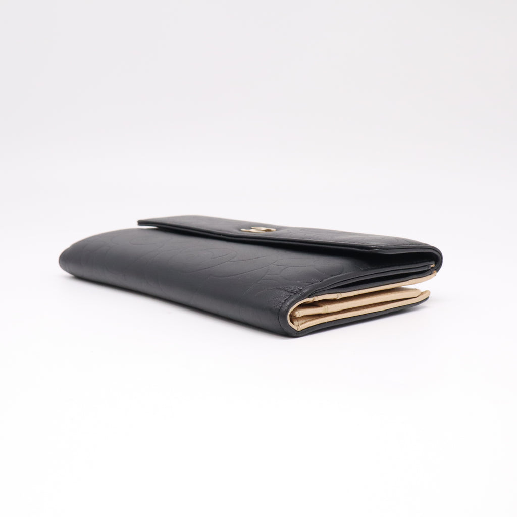Chanel Lambskin Camellia Embossed Flap Wallet Black W22271