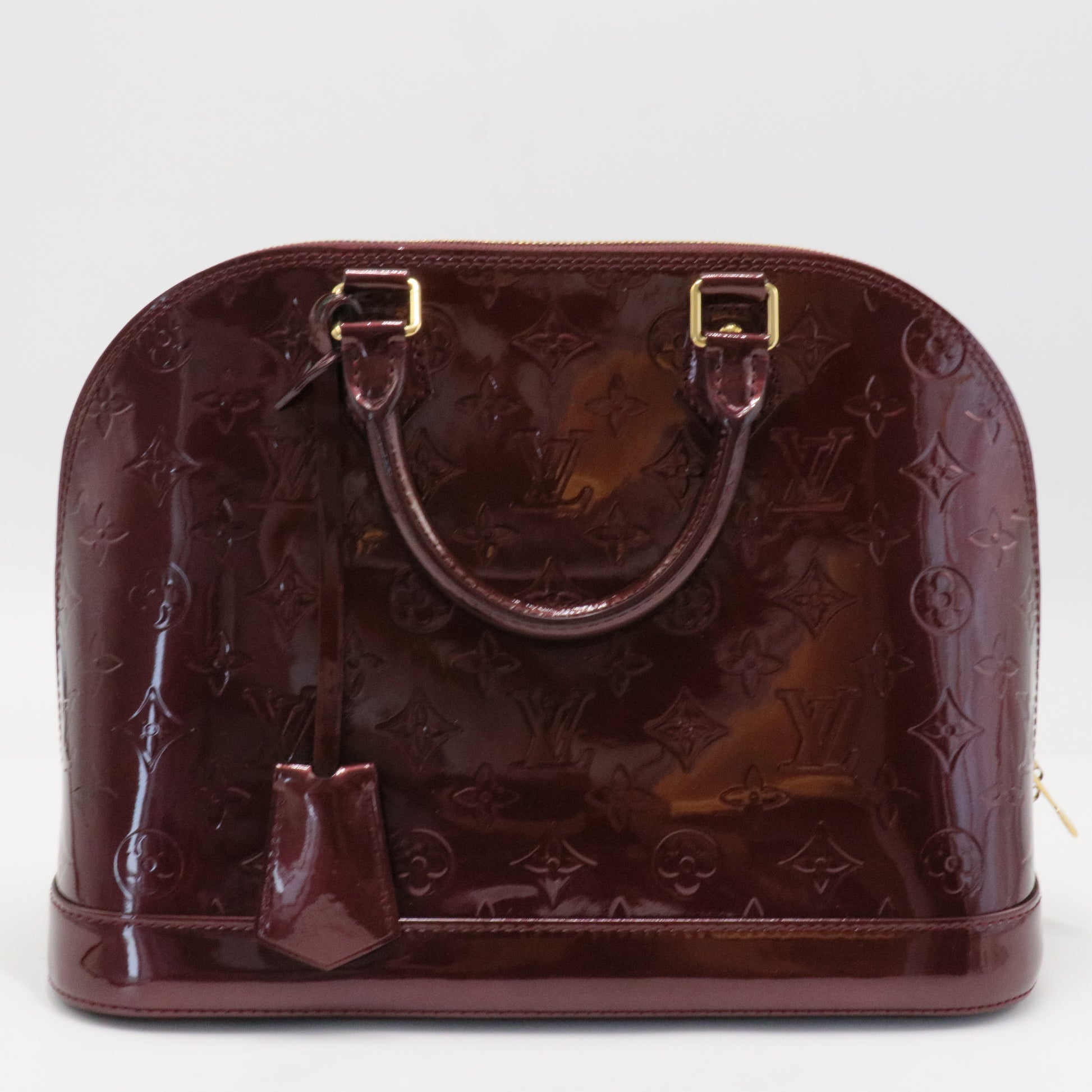 Alma Handbag Monogram Vernis PM