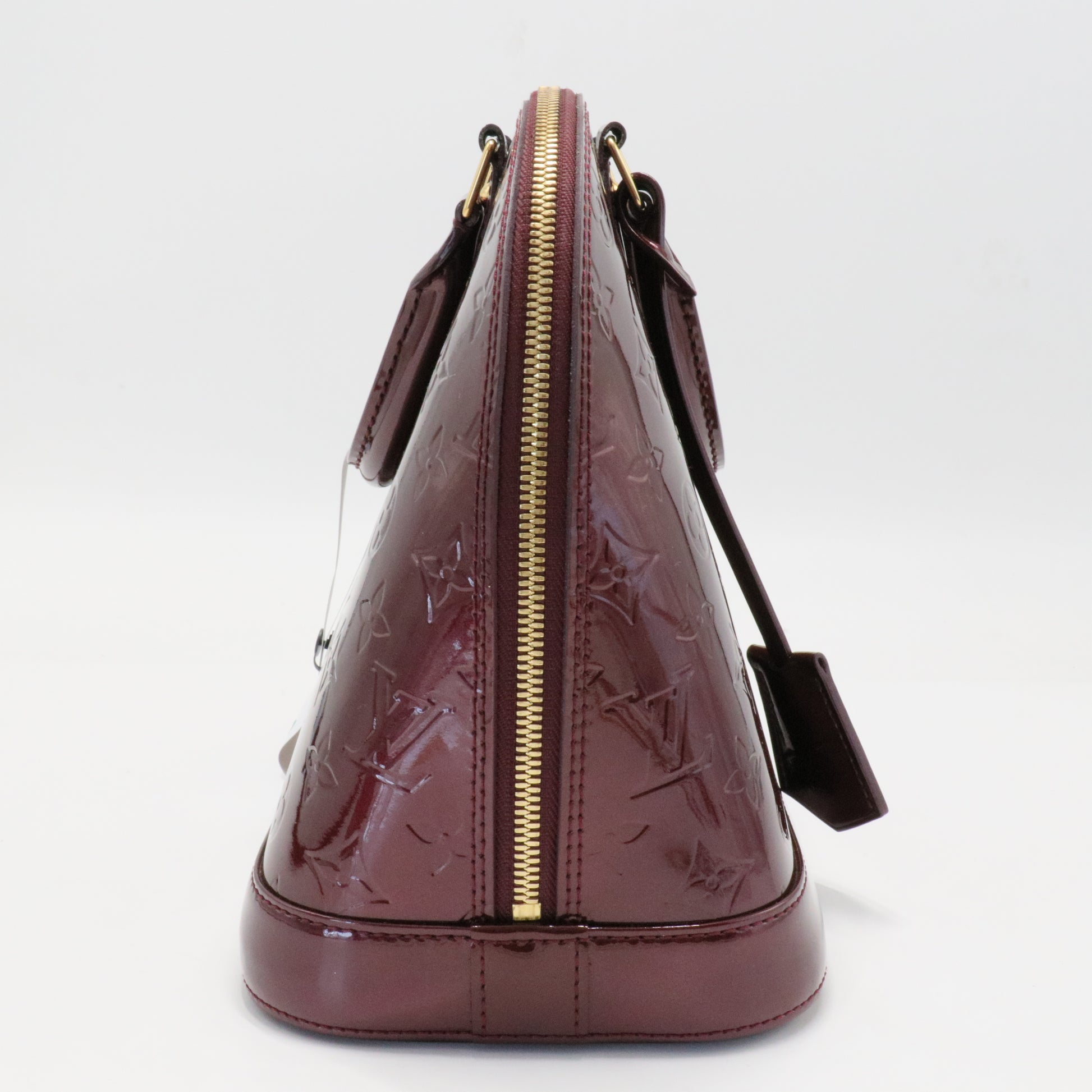 Alma Handbag Monogram Vernis PM